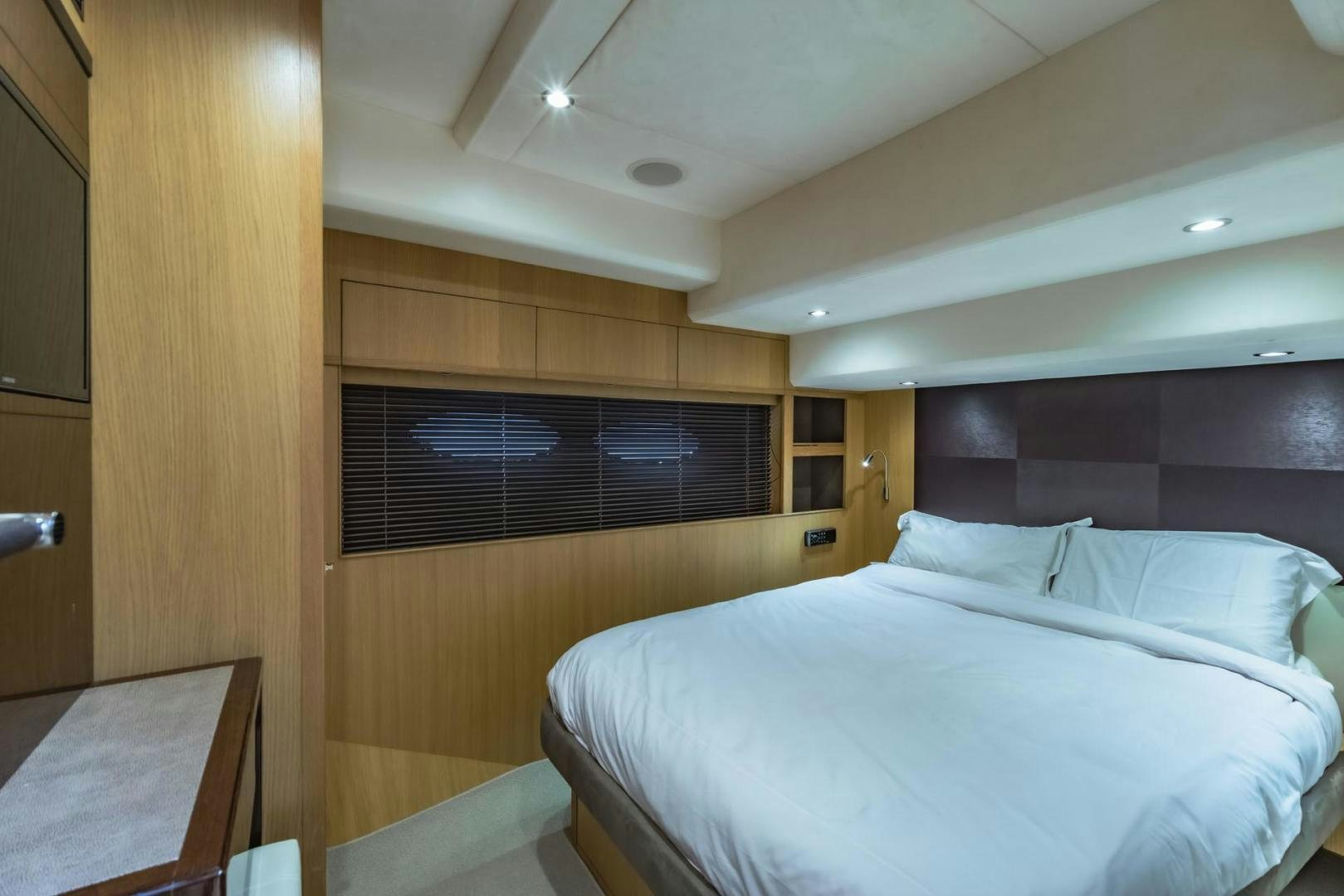 a room with a bed and a window aboard GIFZY Yacht for Sale