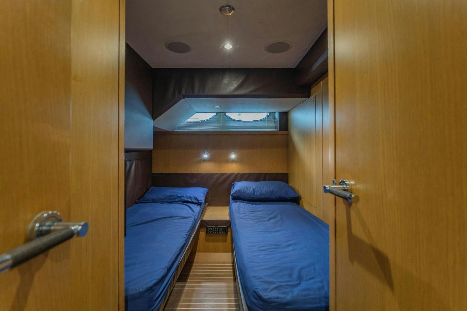 a room with a couple of beds aboard GIFZY Yacht for Sale