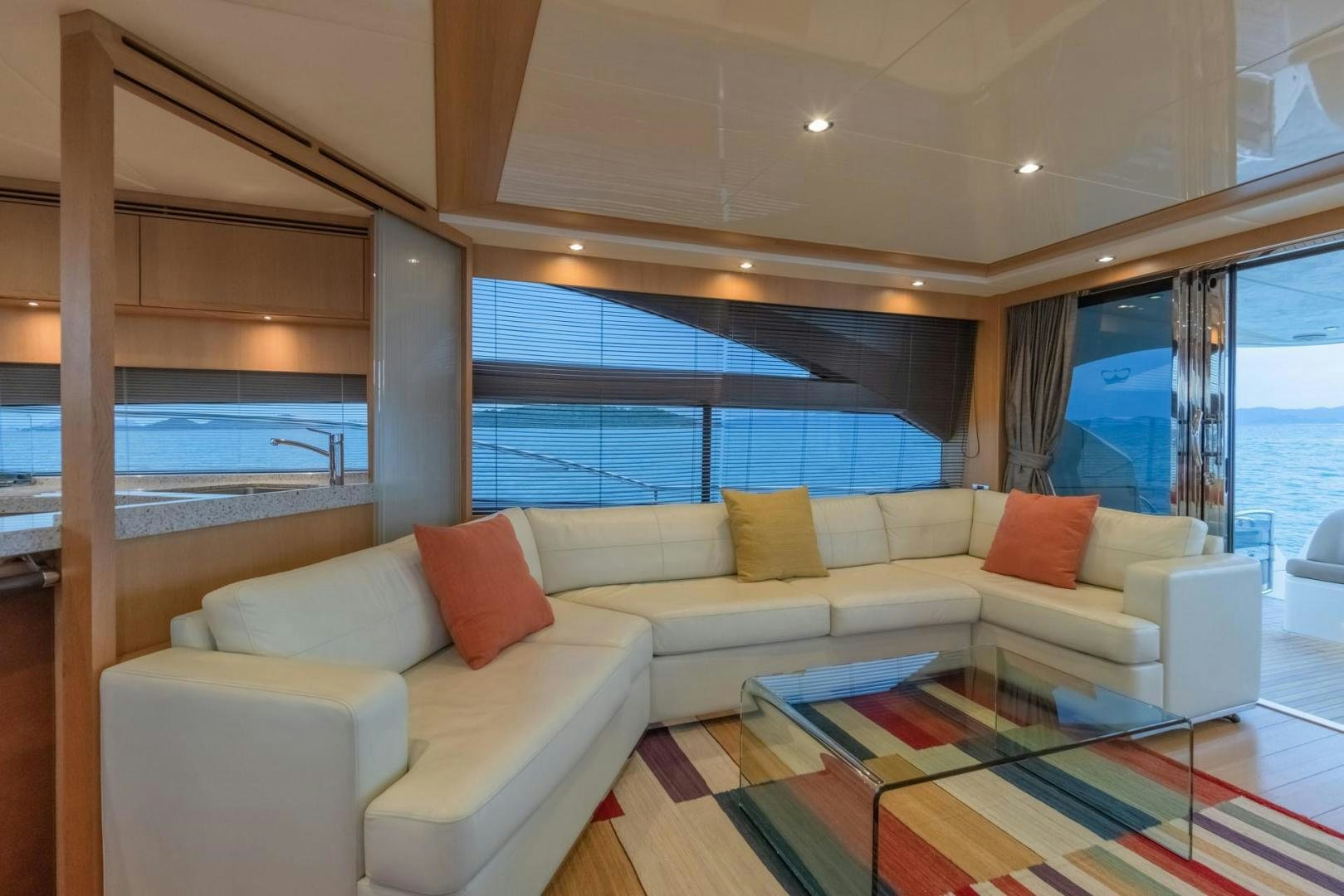 a living room with a large window aboard GIFZY Yacht for Sale