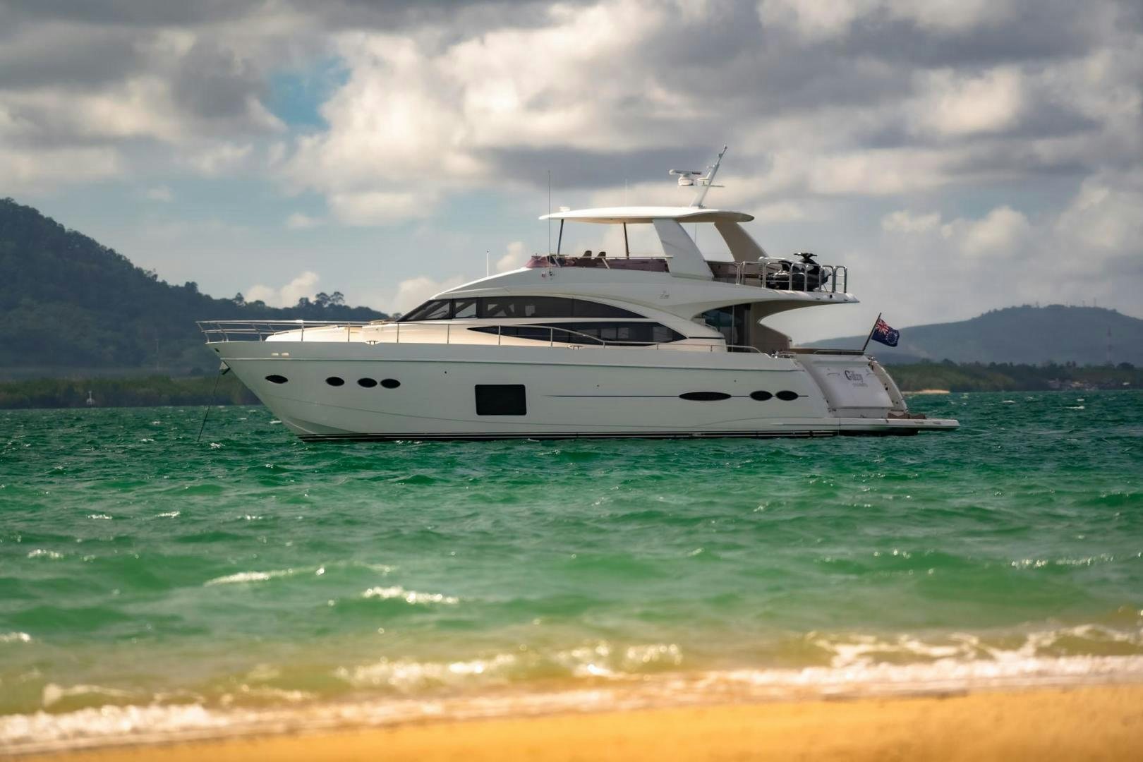 a white yacht in the water aboard GIFZY Yacht for Sale