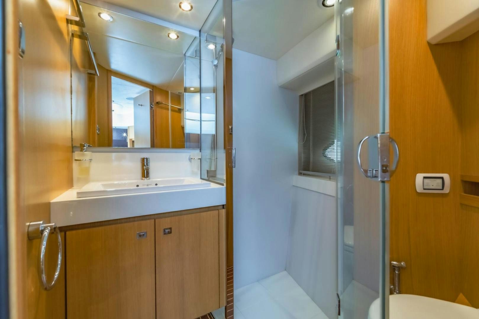 a bathroom with a sink and a mirror aboard GIFZY Yacht for Sale