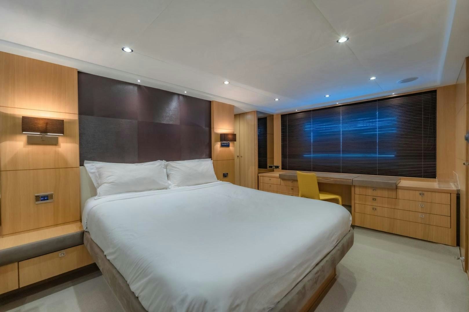 a room with a bed and a desk aboard GIFZY Yacht for Sale