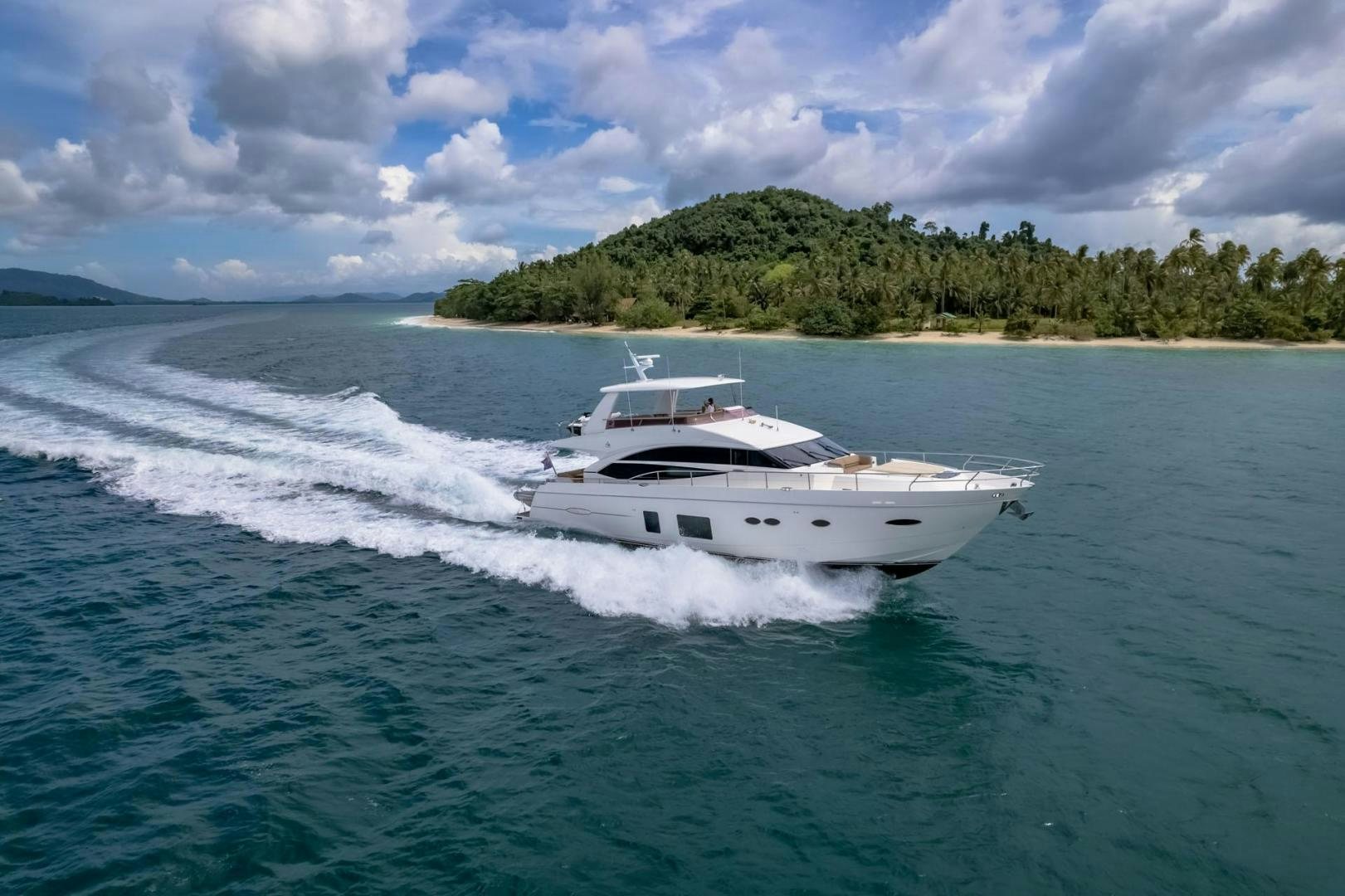 a white boat on water aboard GIFZY Yacht for Sale