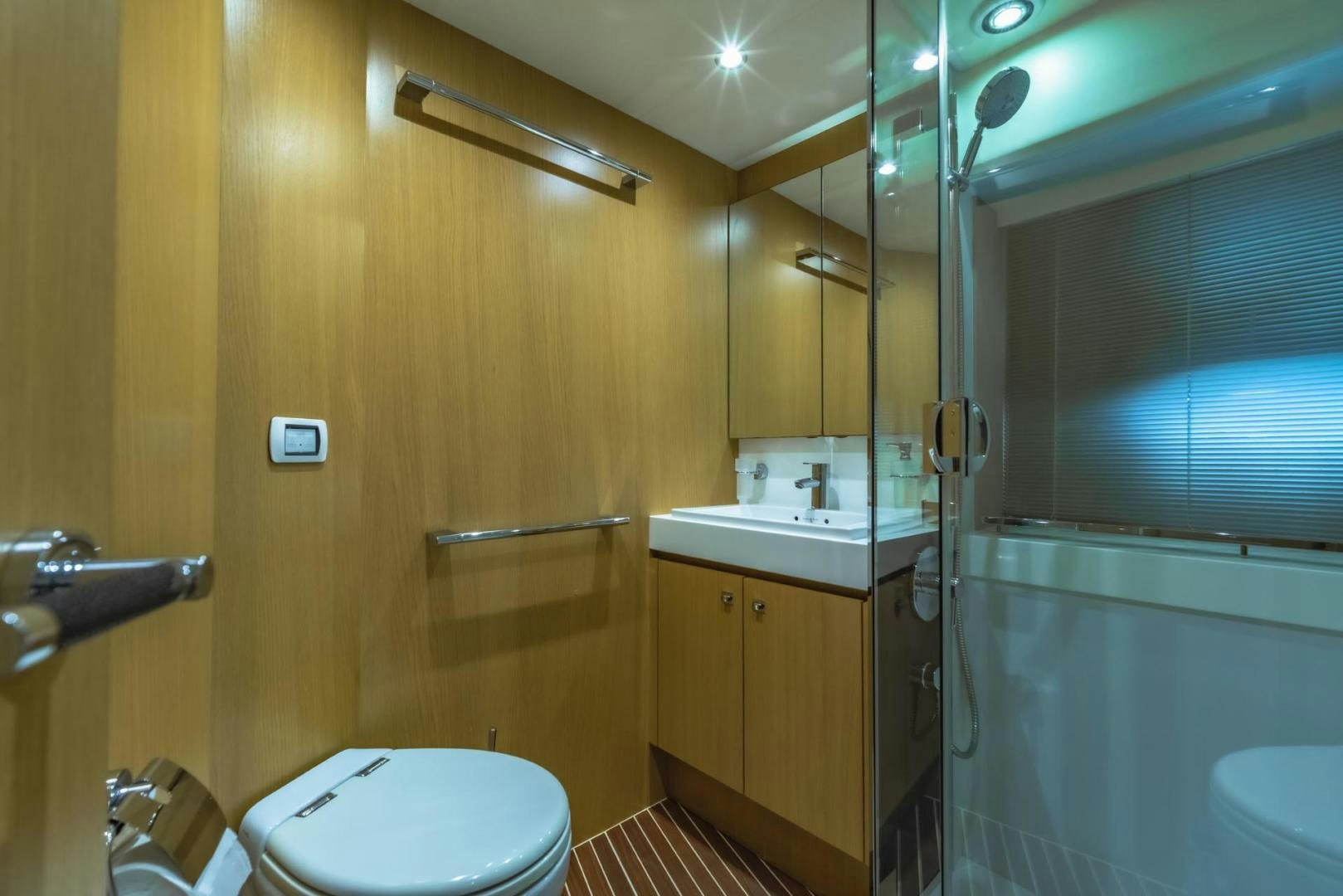 a bathroom with a toilet and sink aboard GIFZY Yacht for Sale