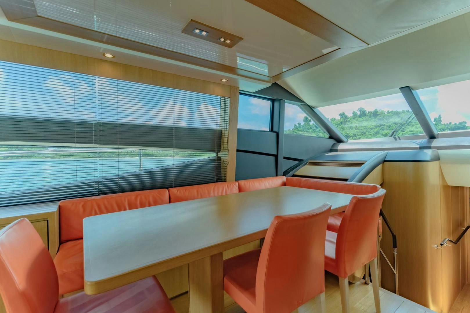 a room with a table and chairs aboard GIFZY Yacht for Sale