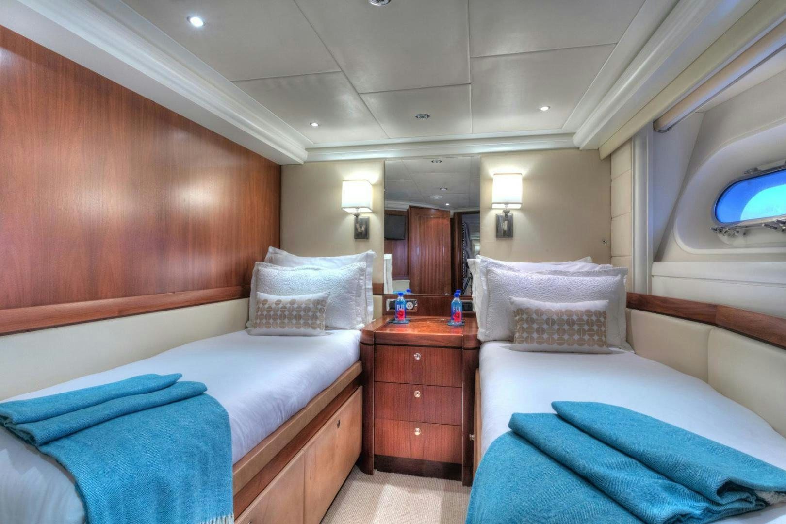 a room with two beds aboard PURA VIDA Yacht for Sale