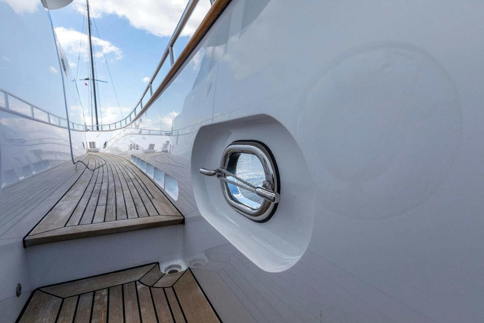 a white car with a round window aboard PURA VIDA Yacht for Sale