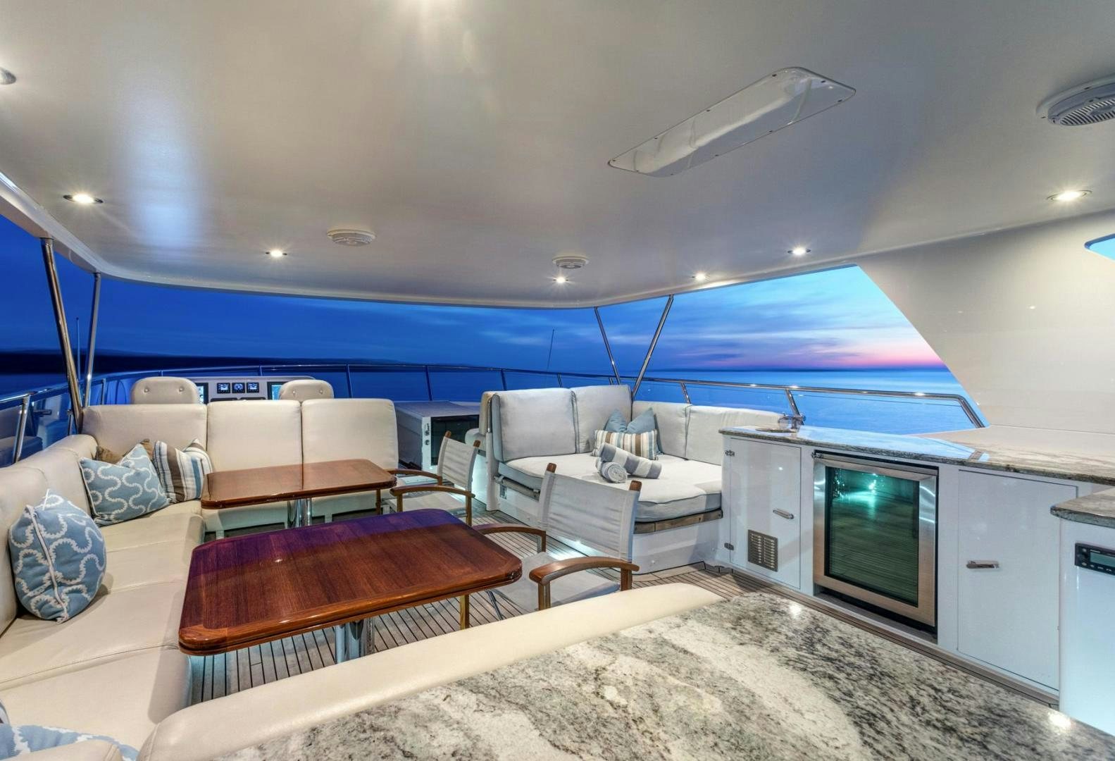 a large living room with a large swimming pool aboard PURA VIDA Yacht for Sale