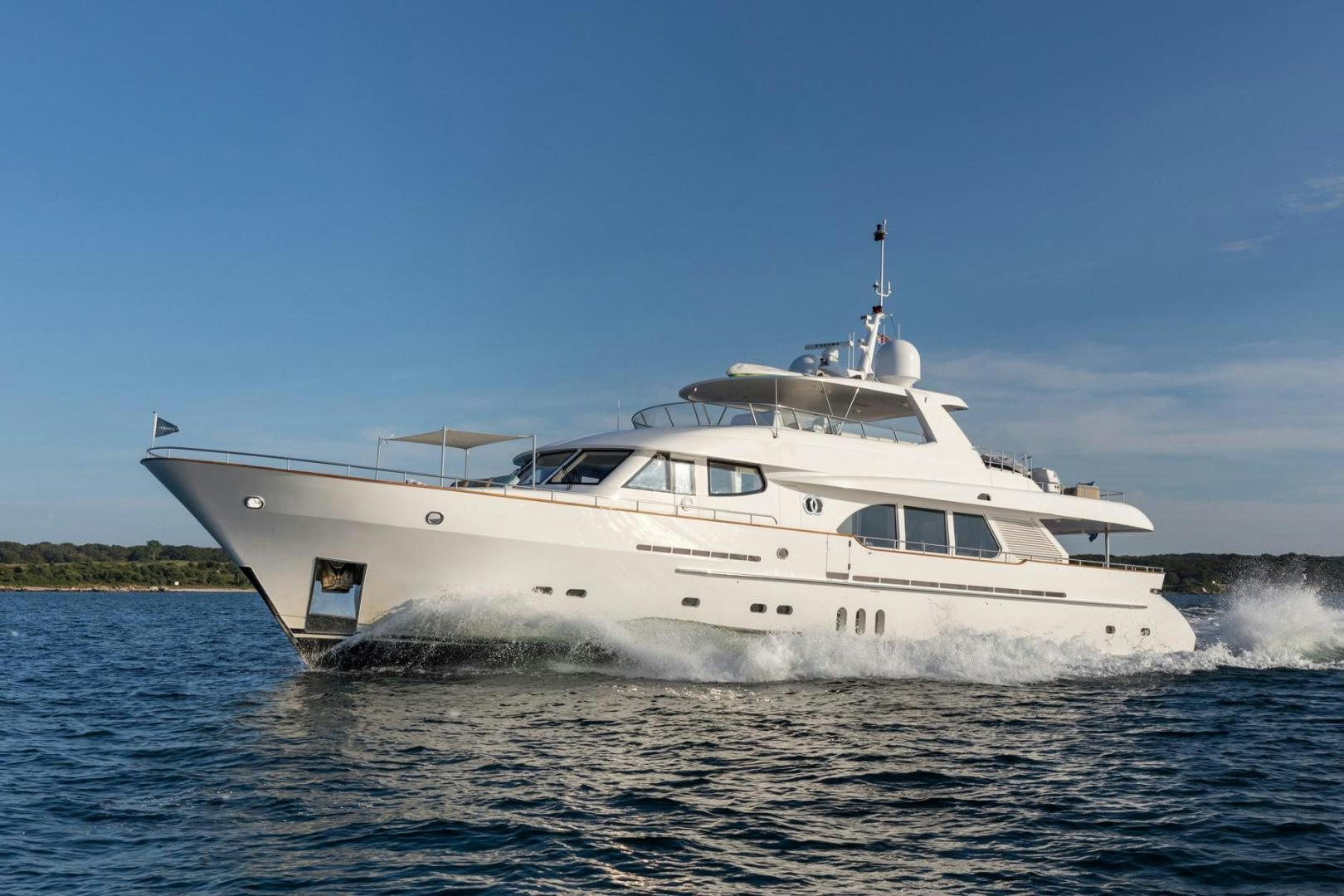 a white boat on the water aboard PURA VIDA Yacht for Sale