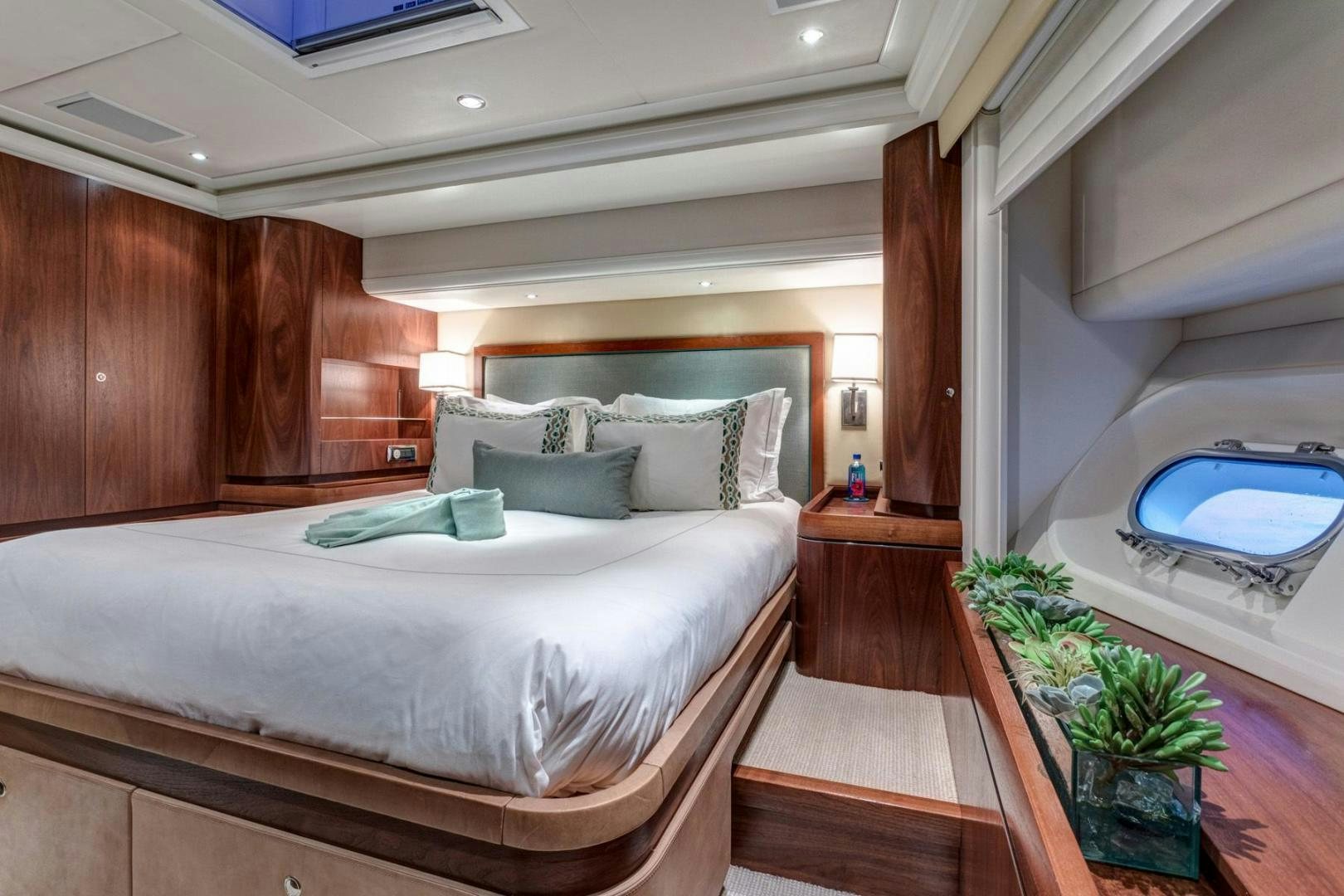 a bed in a room aboard PURA VIDA Yacht for Sale