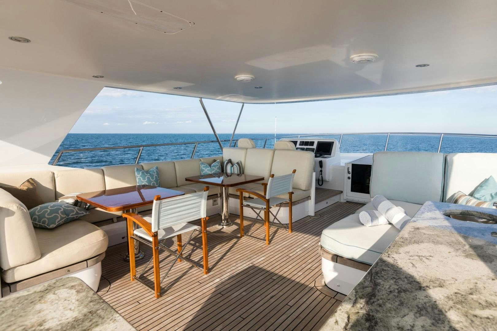a large living room with a large blue and white tent aboard PURA VIDA Yacht for Sale
