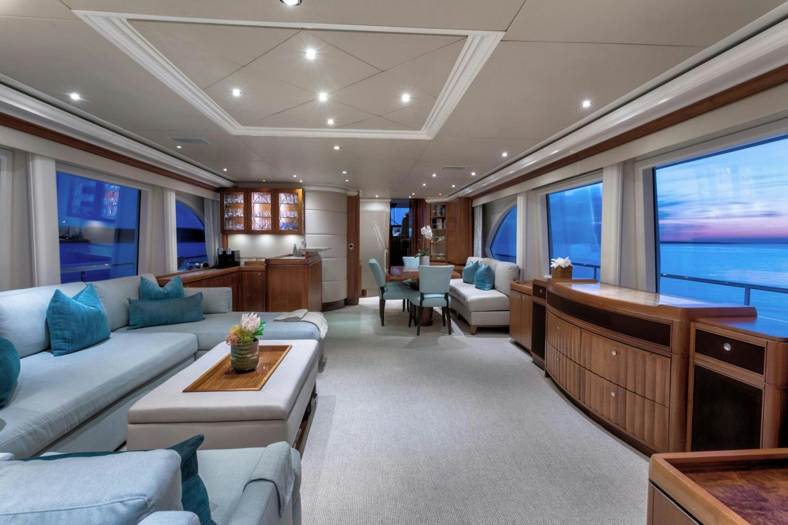 a living room with a large window aboard PURA VIDA Yacht for Sale