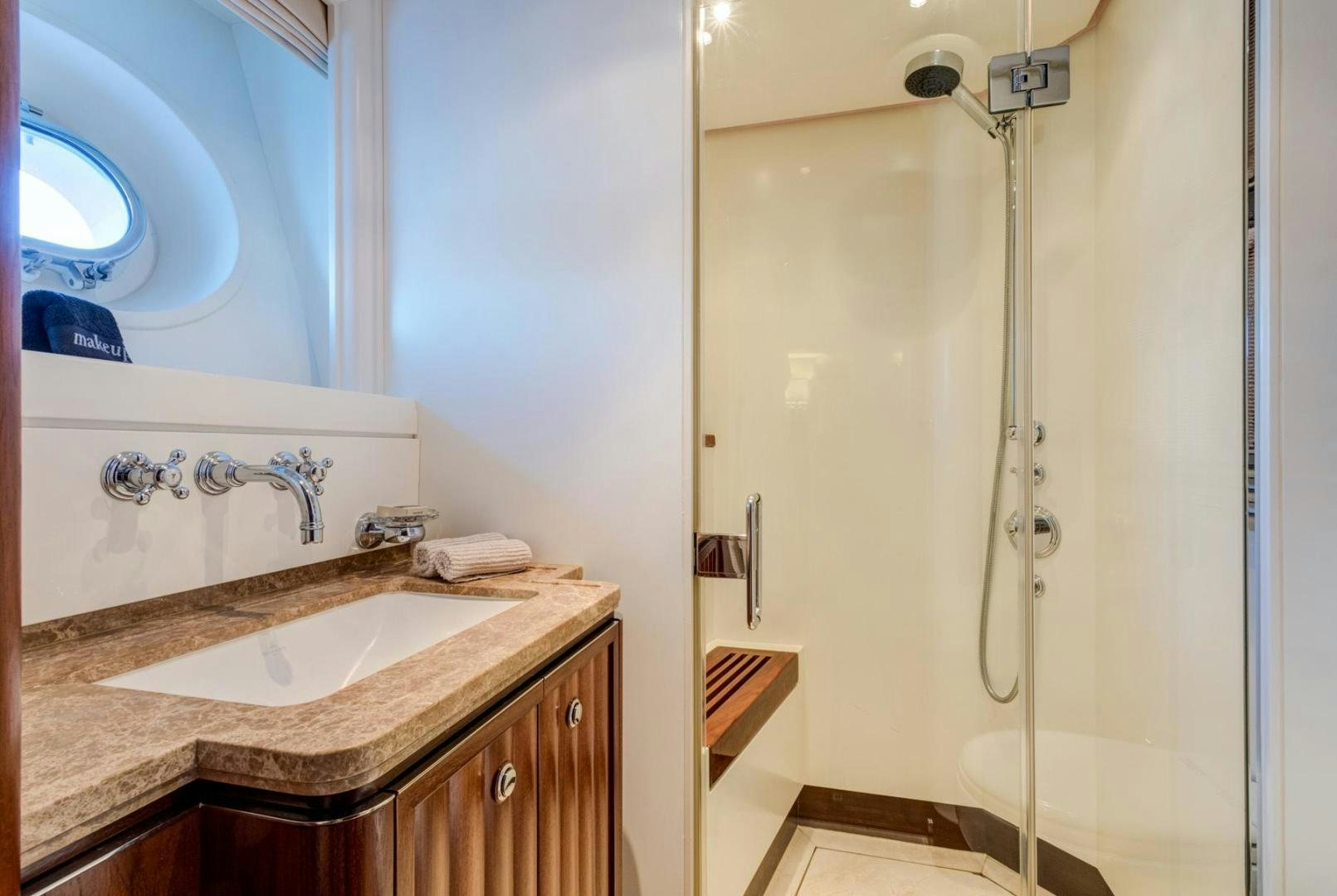a bathroom with a sink and a shower aboard PURA VIDA Yacht for Sale