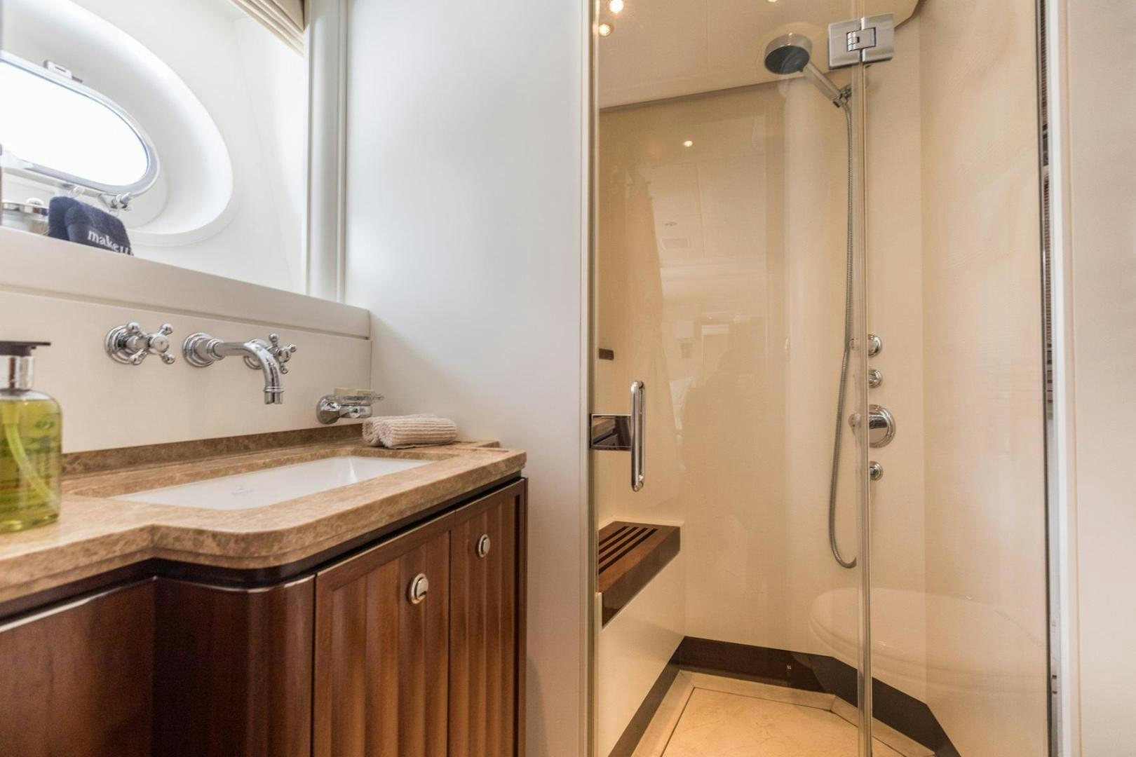 a bathroom with a sink and a shower aboard PURA VIDA Yacht for Sale