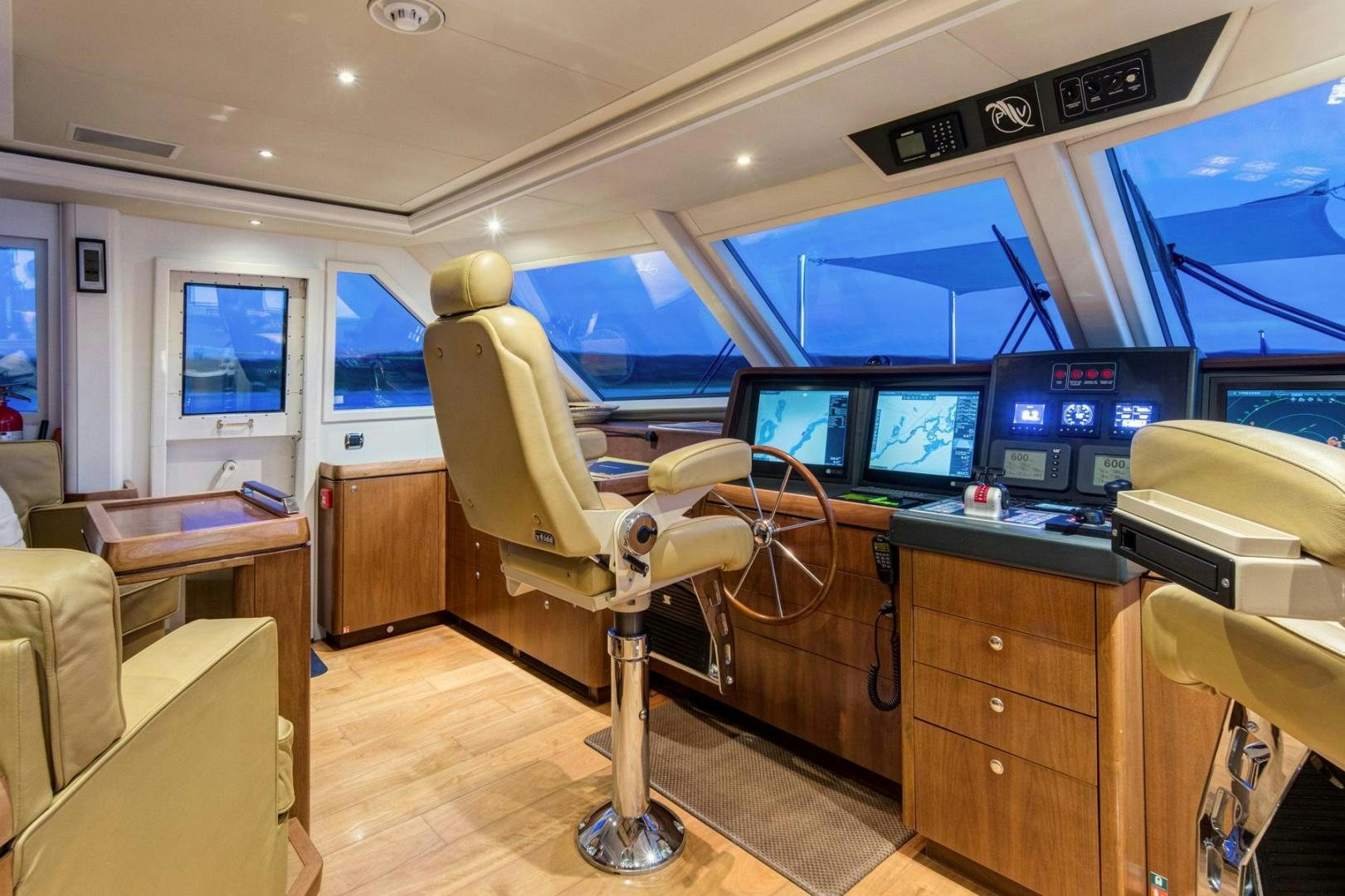 a room with a desk and a television aboard PURA VIDA Yacht for Sale