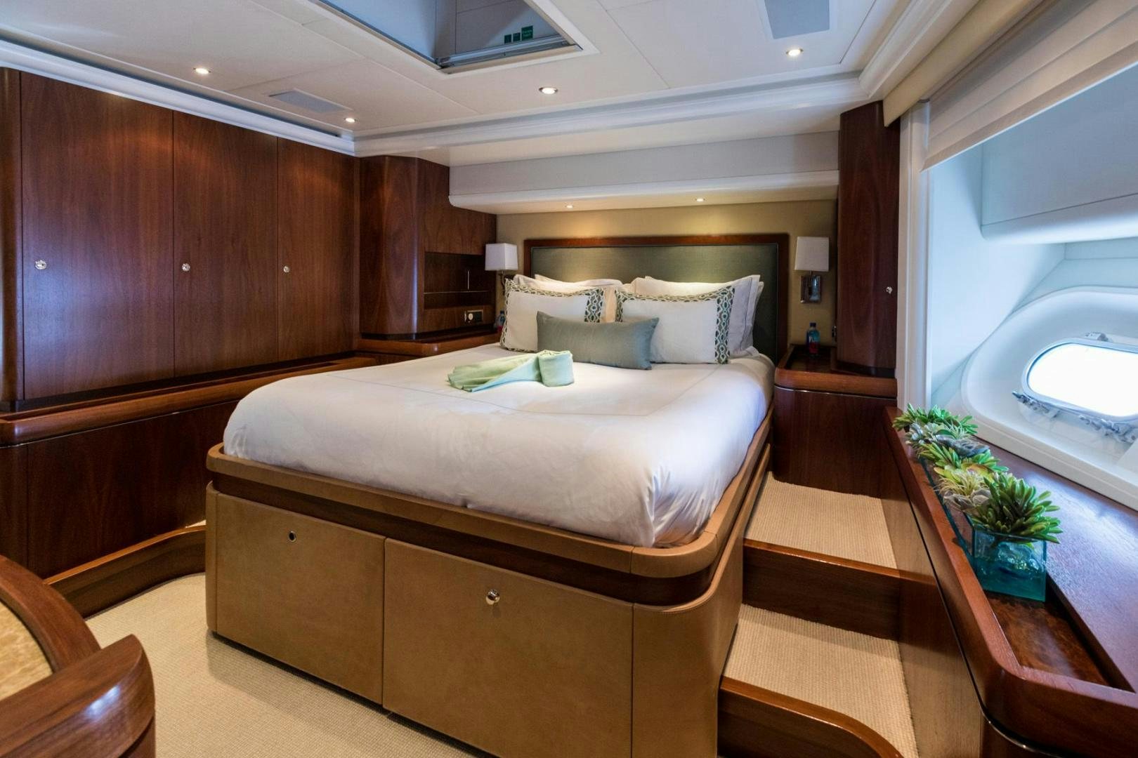 a bed in a room aboard PURA VIDA Yacht for Sale