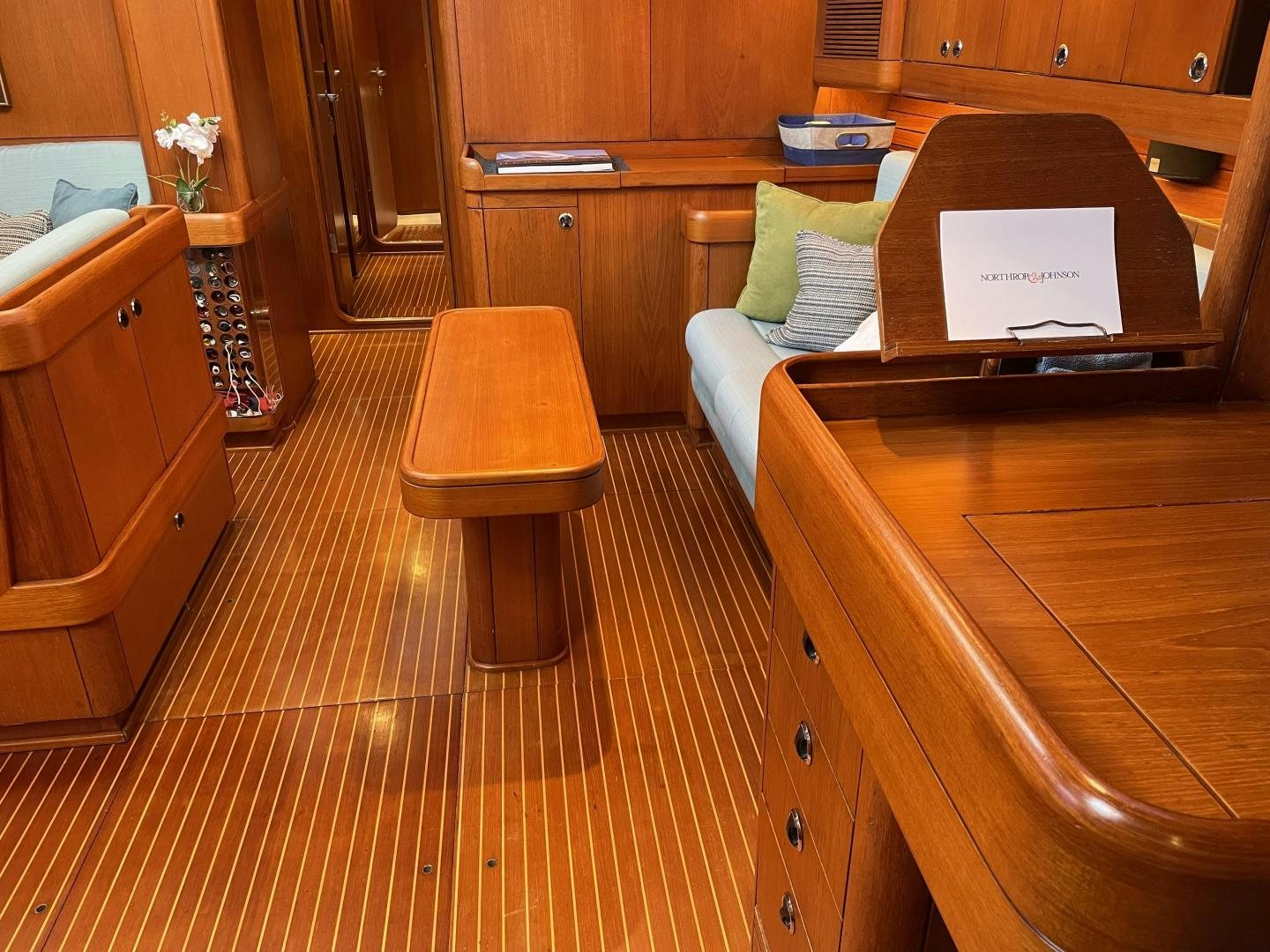a room with a couch and a desk aboard DISCO LEMONADE Yacht for Sale