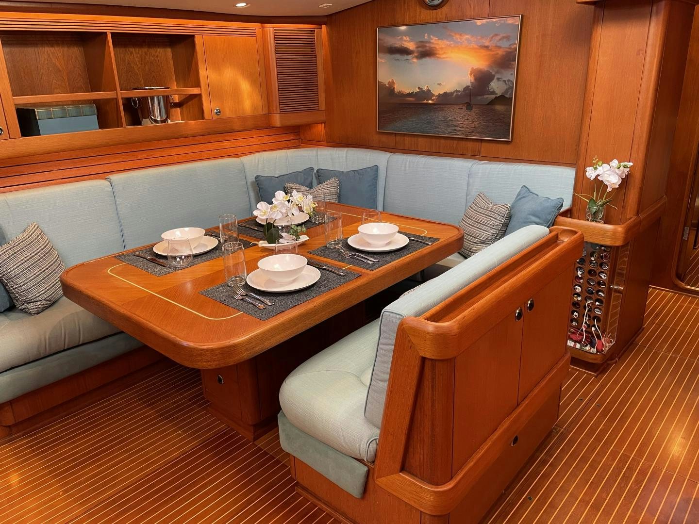 a table with plates and cups on it aboard DISCO LEMONADE Yacht for Sale
