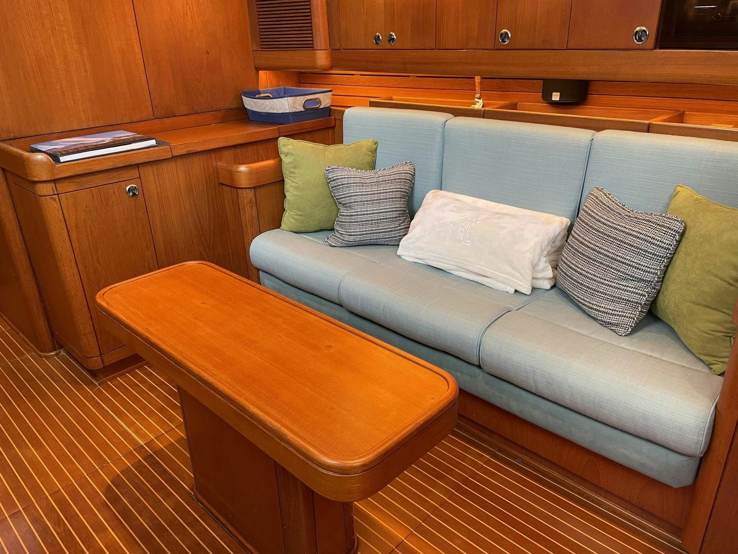 a couch with pillows on it aboard DISCO LEMONADE Yacht for Sale