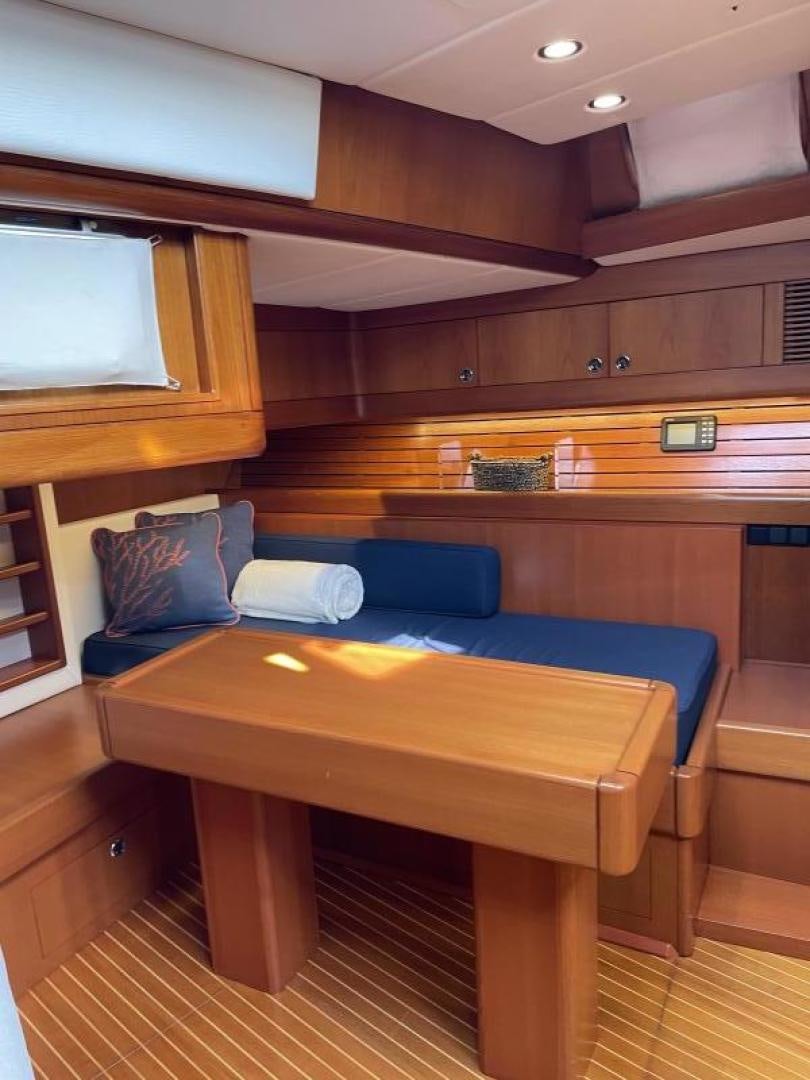 a wood table in a cabin aboard DISCO LEMONADE Yacht for Sale