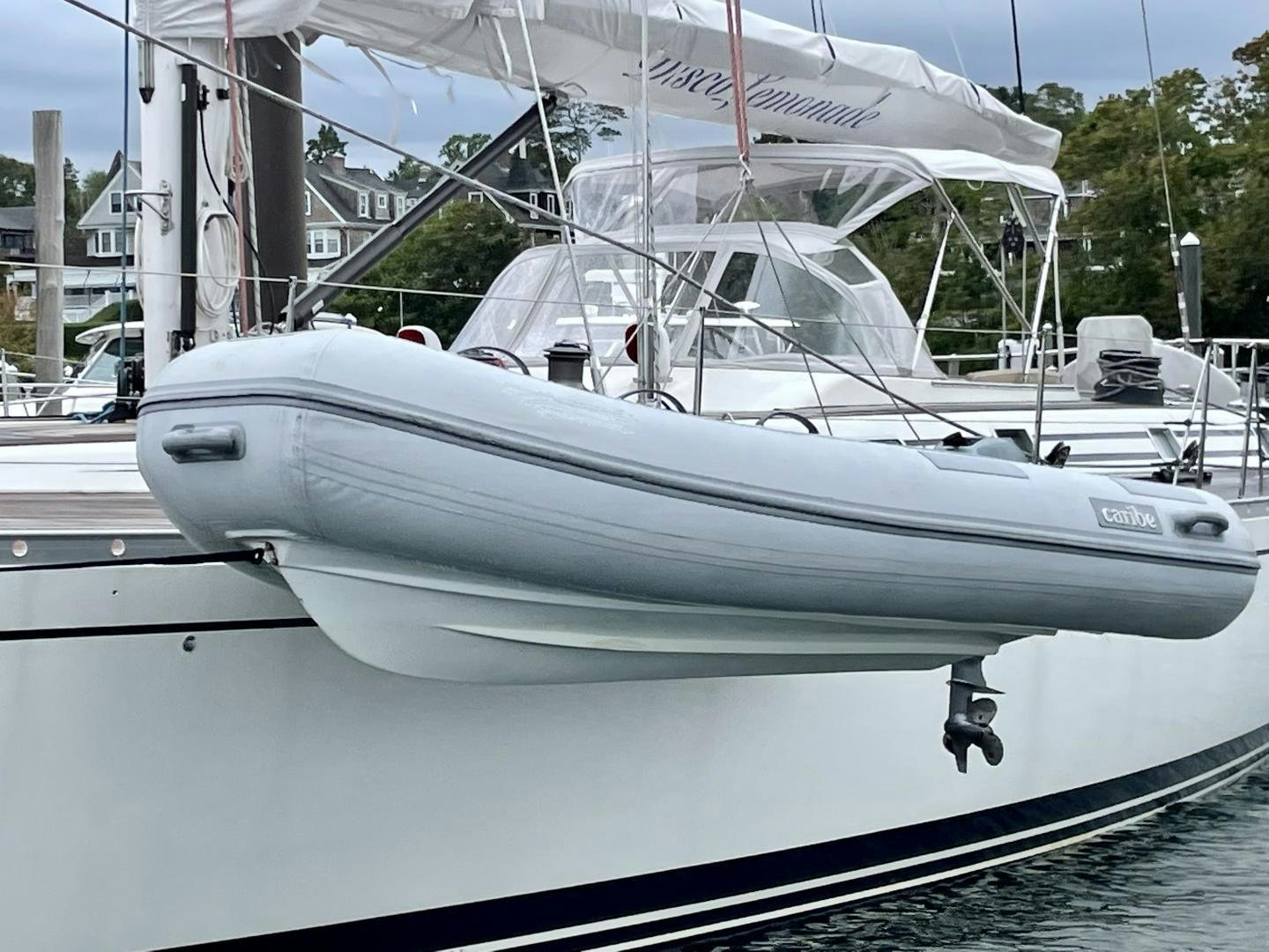 a white boat on a dock aboard DISCO LEMONADE Yacht for Sale