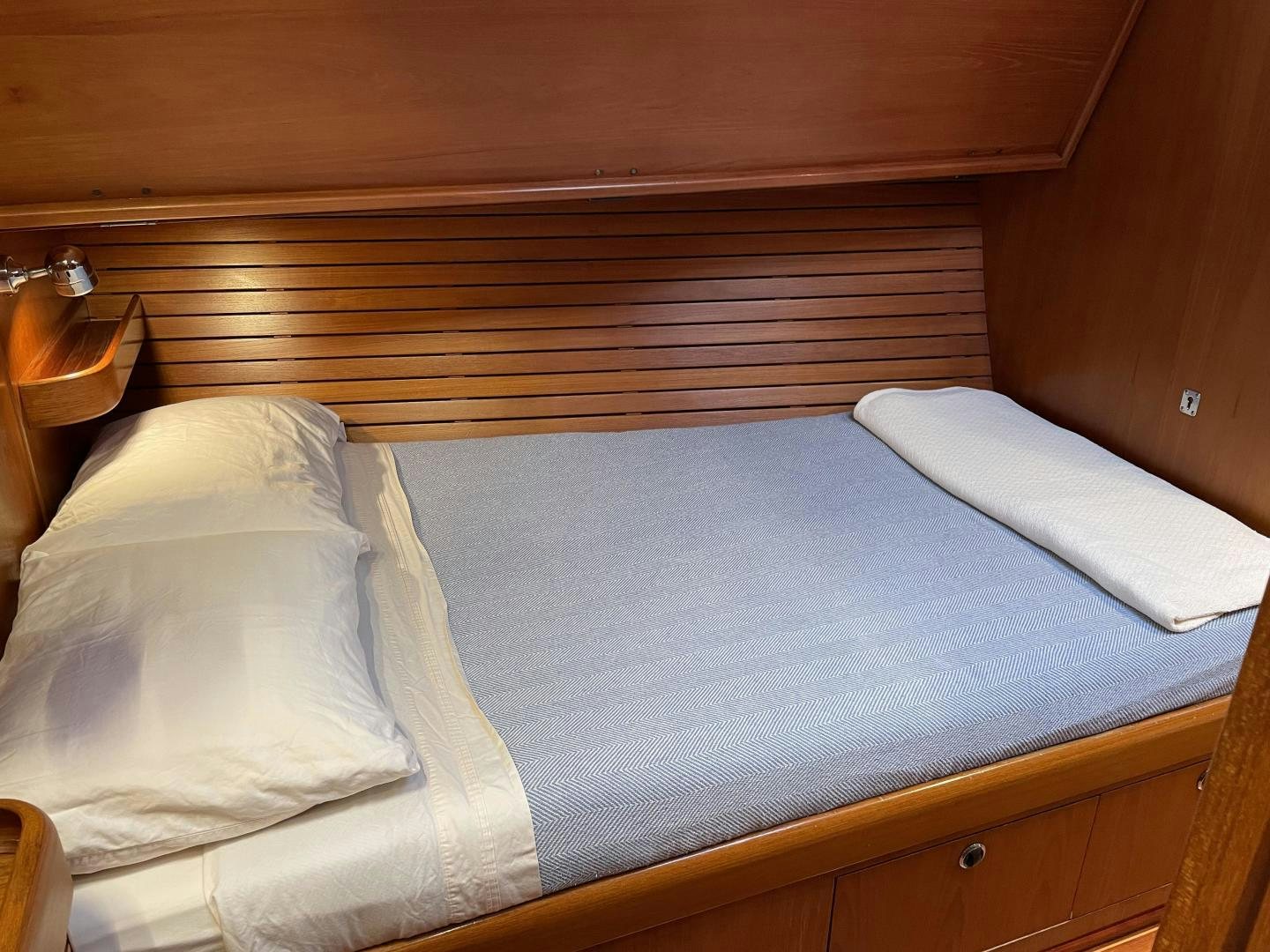 a bed with white sheets aboard DISCO LEMONADE Yacht for Sale