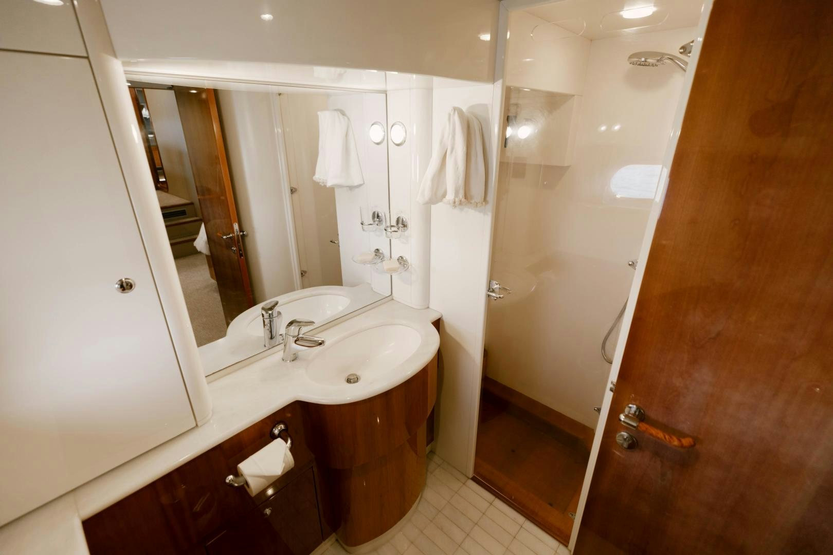 a bathroom with a large mirror aboard LIVING LIFE Yacht for Sale