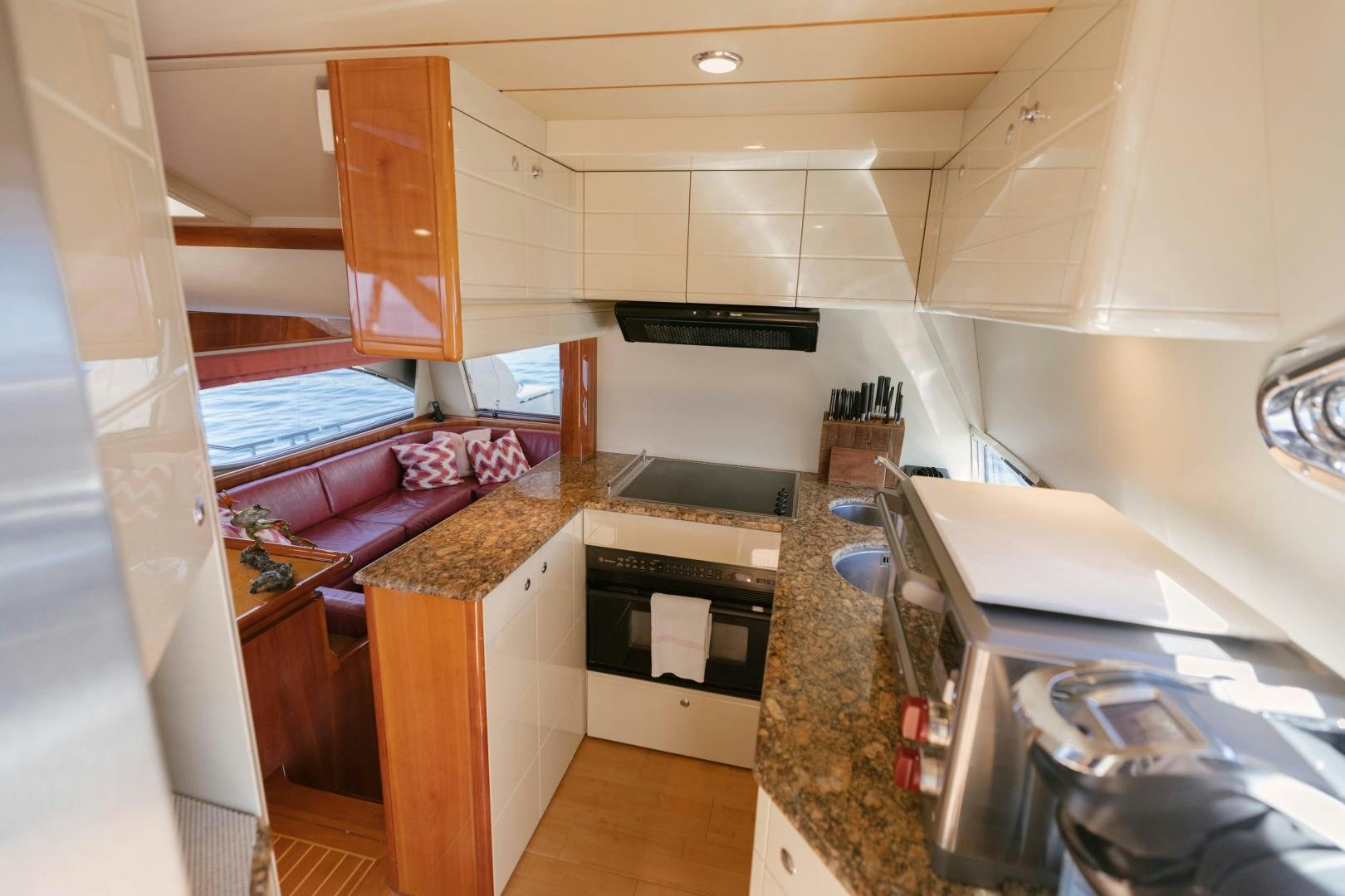 a kitchen with a sink and stove aboard LIVING LIFE Yacht for Sale
