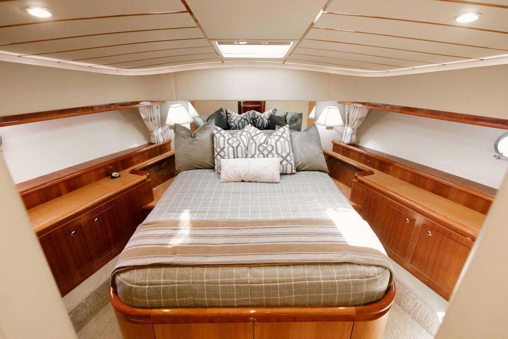 a bed with pillows on it aboard LIVING LIFE Yacht for Sale
