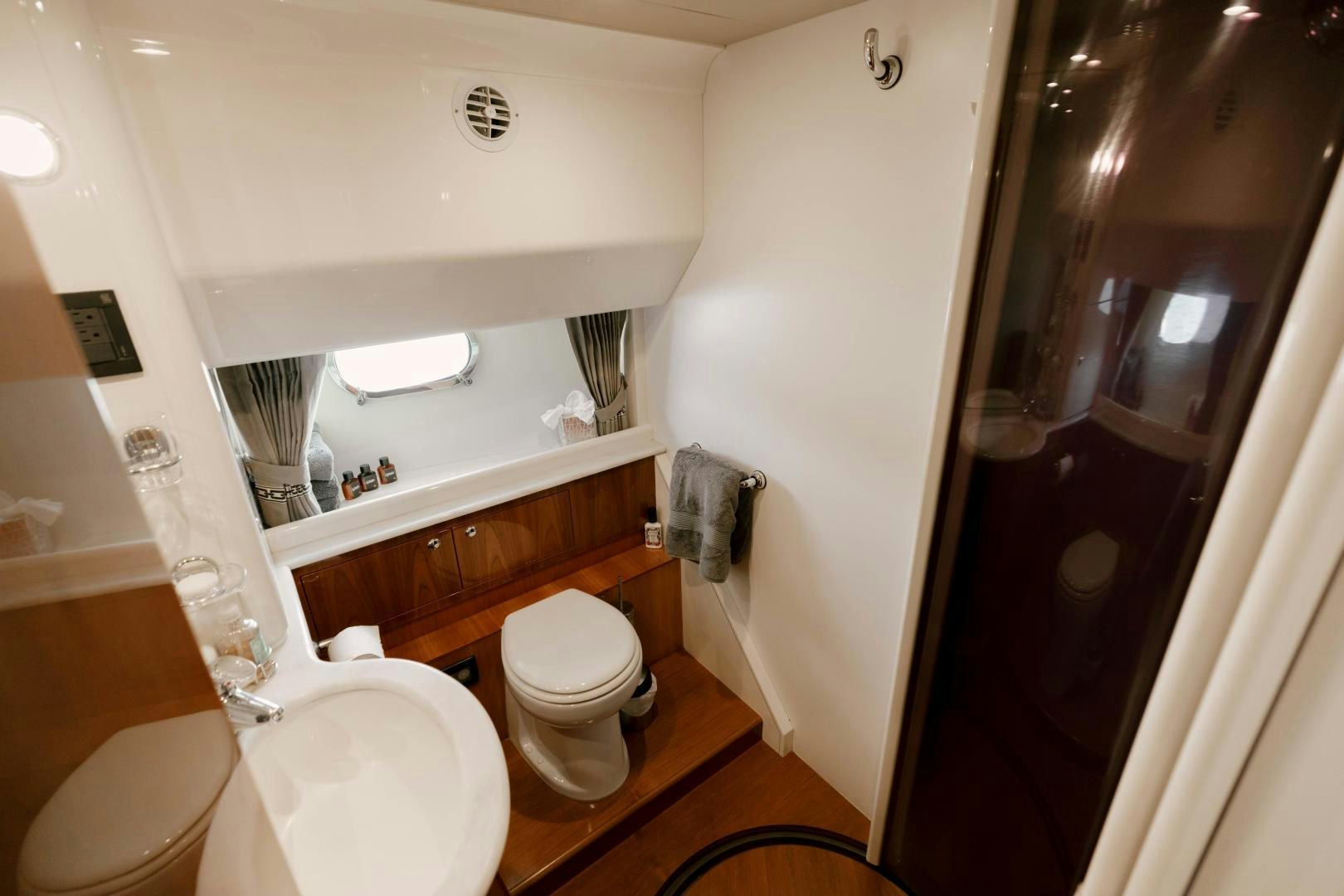 a bathroom with a toilet and a sink aboard LIVING LIFE Yacht for Sale