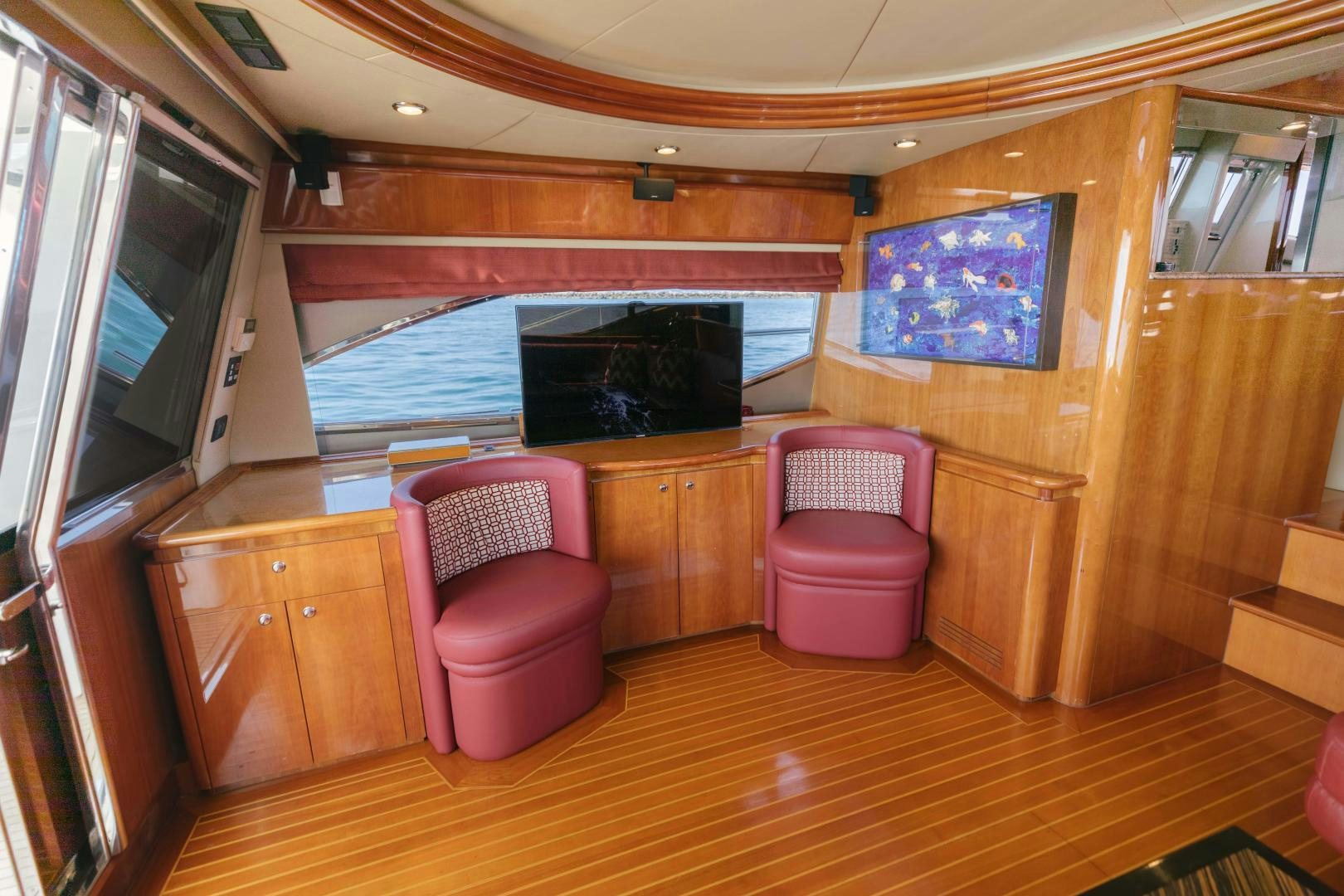 a room with a tv and a chair aboard LIVING LIFE Yacht for Sale