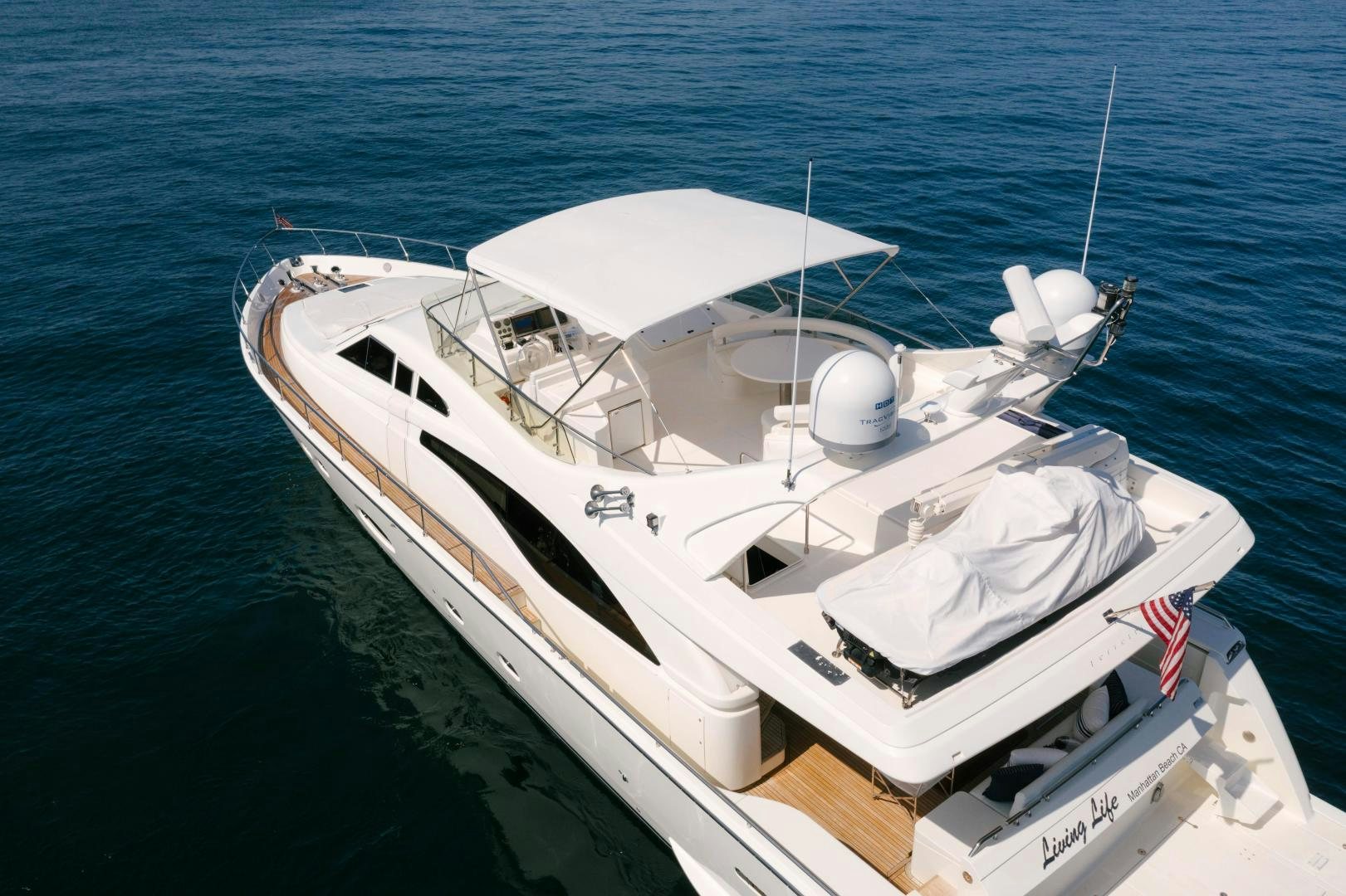 a white boat on the water aboard LIVING LIFE Yacht for Sale