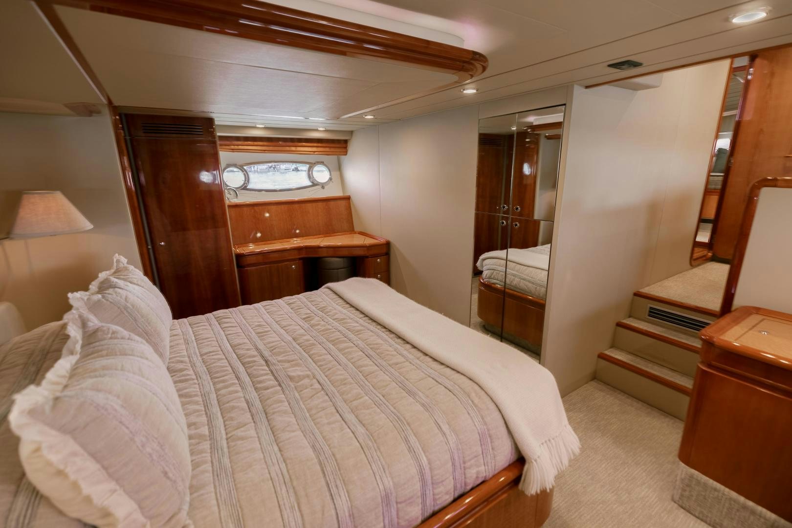 a bed with white sheets aboard LIVING LIFE Yacht for Sale
