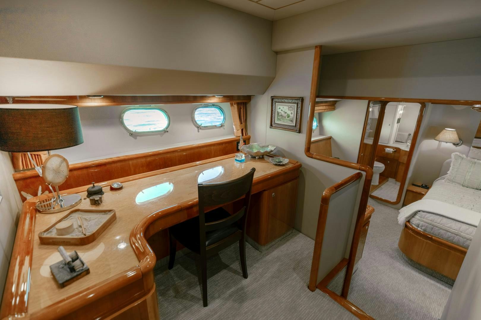 a room with a desk and chairs aboard LIVING LIFE Yacht for Sale