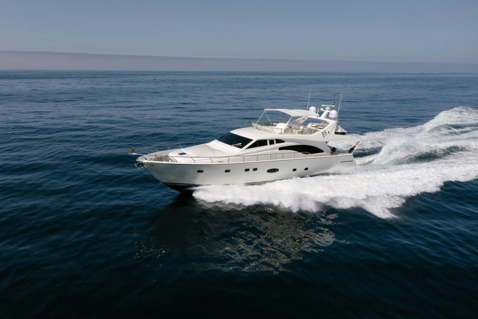 a white yacht on the water aboard LIVING LIFE Yacht for Sale