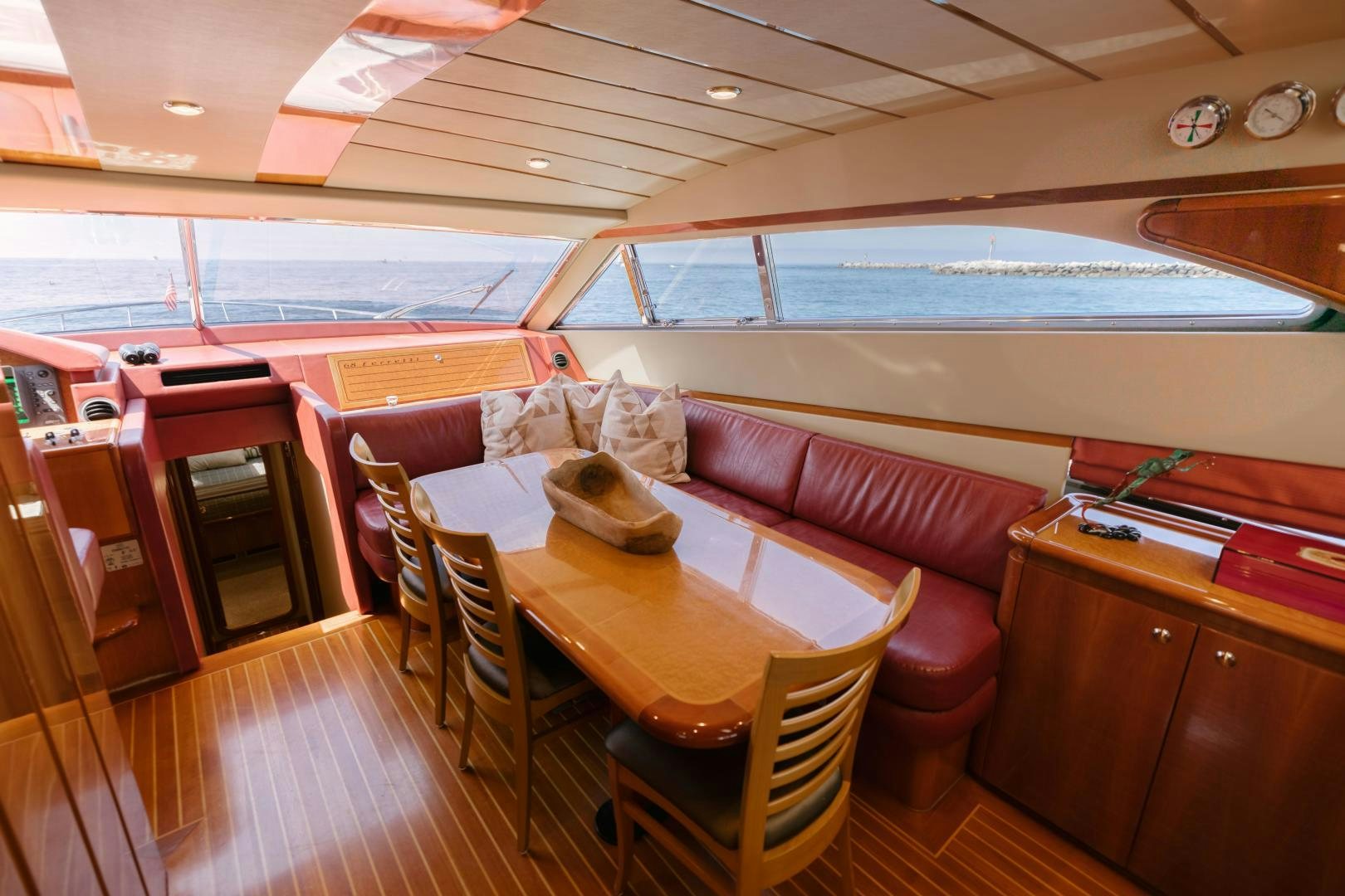 a room with a table and chairs aboard LIVING LIFE Yacht for Sale