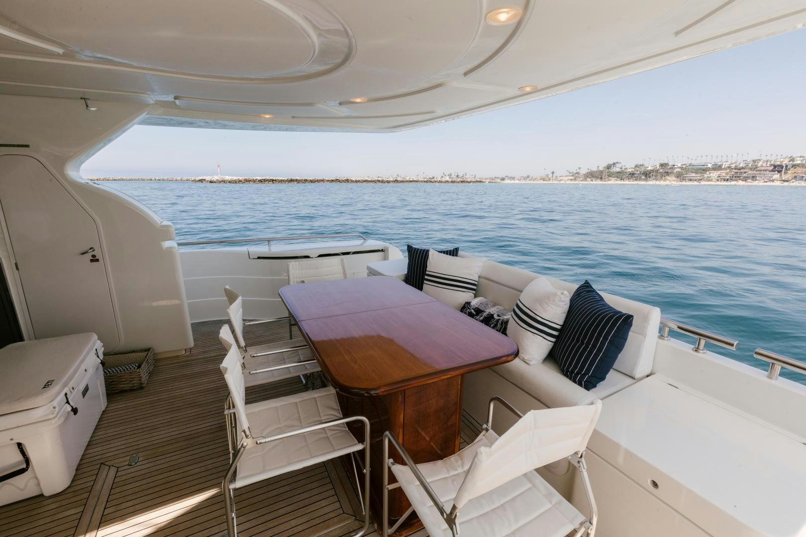 a boat with chairs and tables on the deck aboard LIVING LIFE Yacht for Sale