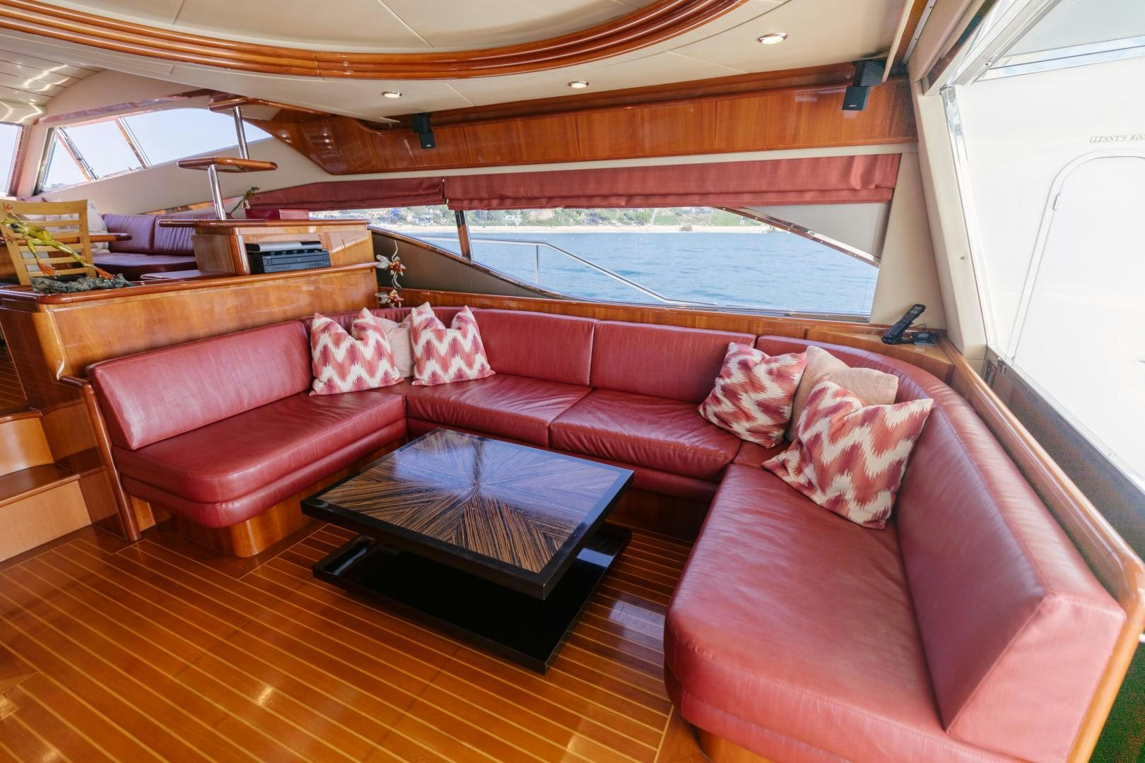 a living room with a couch and a table aboard LIVING LIFE Yacht for Sale