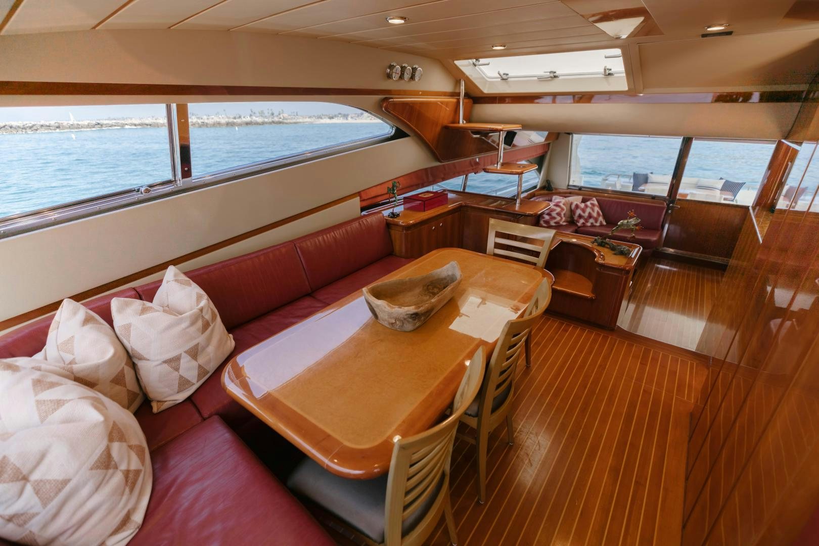 a living room with a table and chairs aboard LIVING LIFE Yacht for Sale