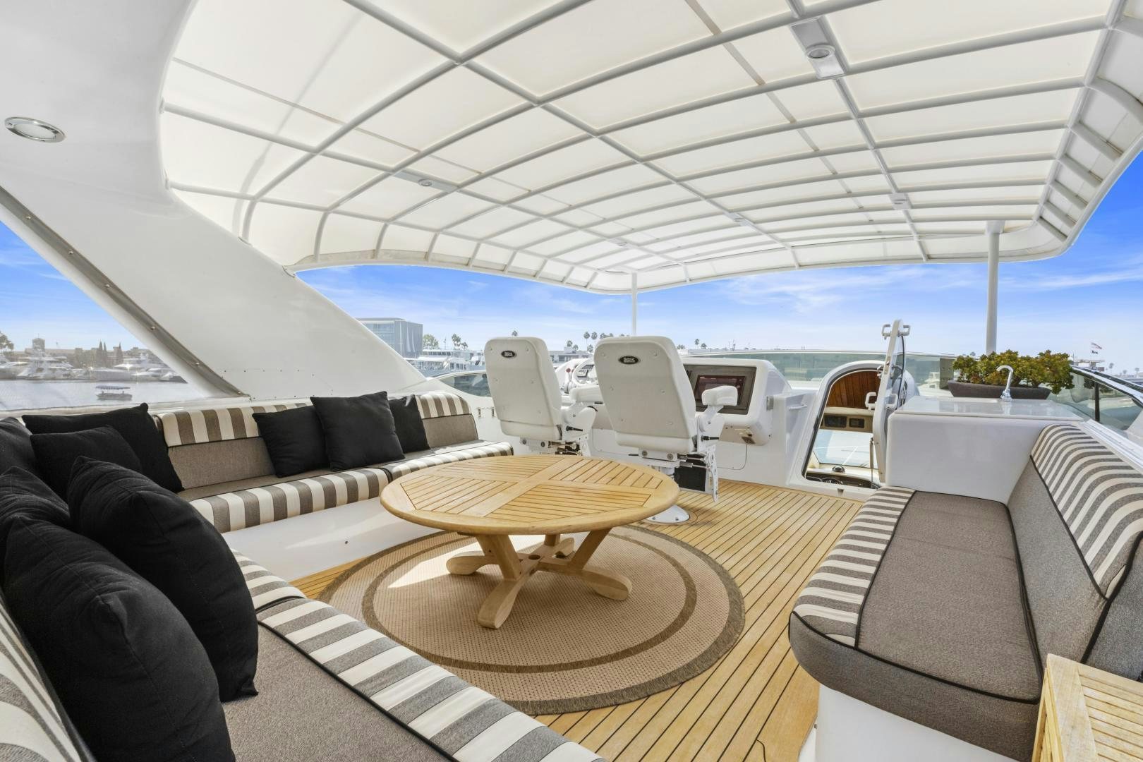 a room with a couch and a table and chairs aboard RILASSARI Yacht for Sale