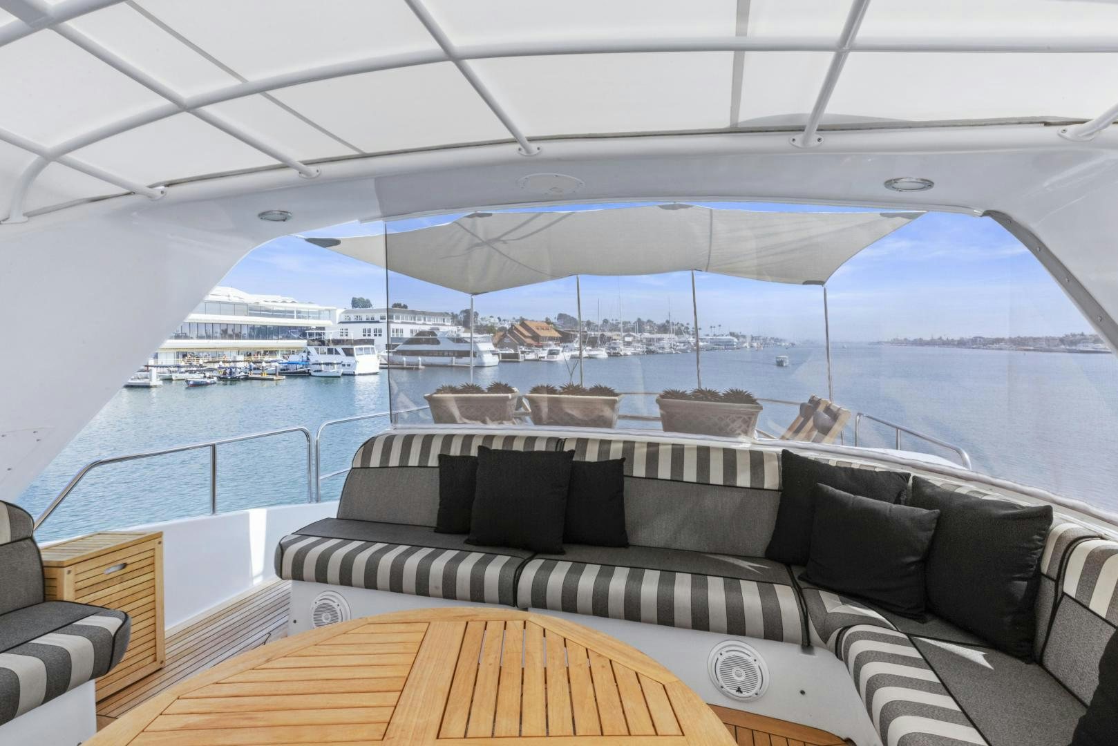 a large lounge area with a large cruise ship in the background aboard RILASSARI Yacht for Sale
