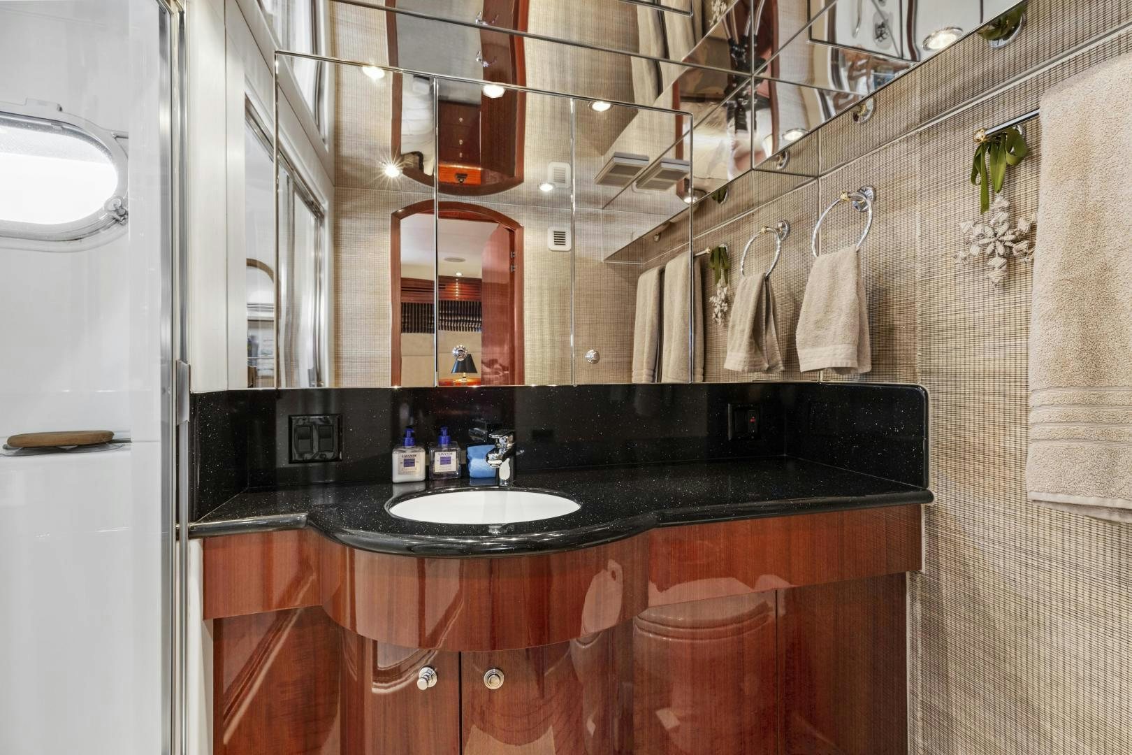 a bathroom with a sink and mirror aboard RILASSARI Yacht for Sale