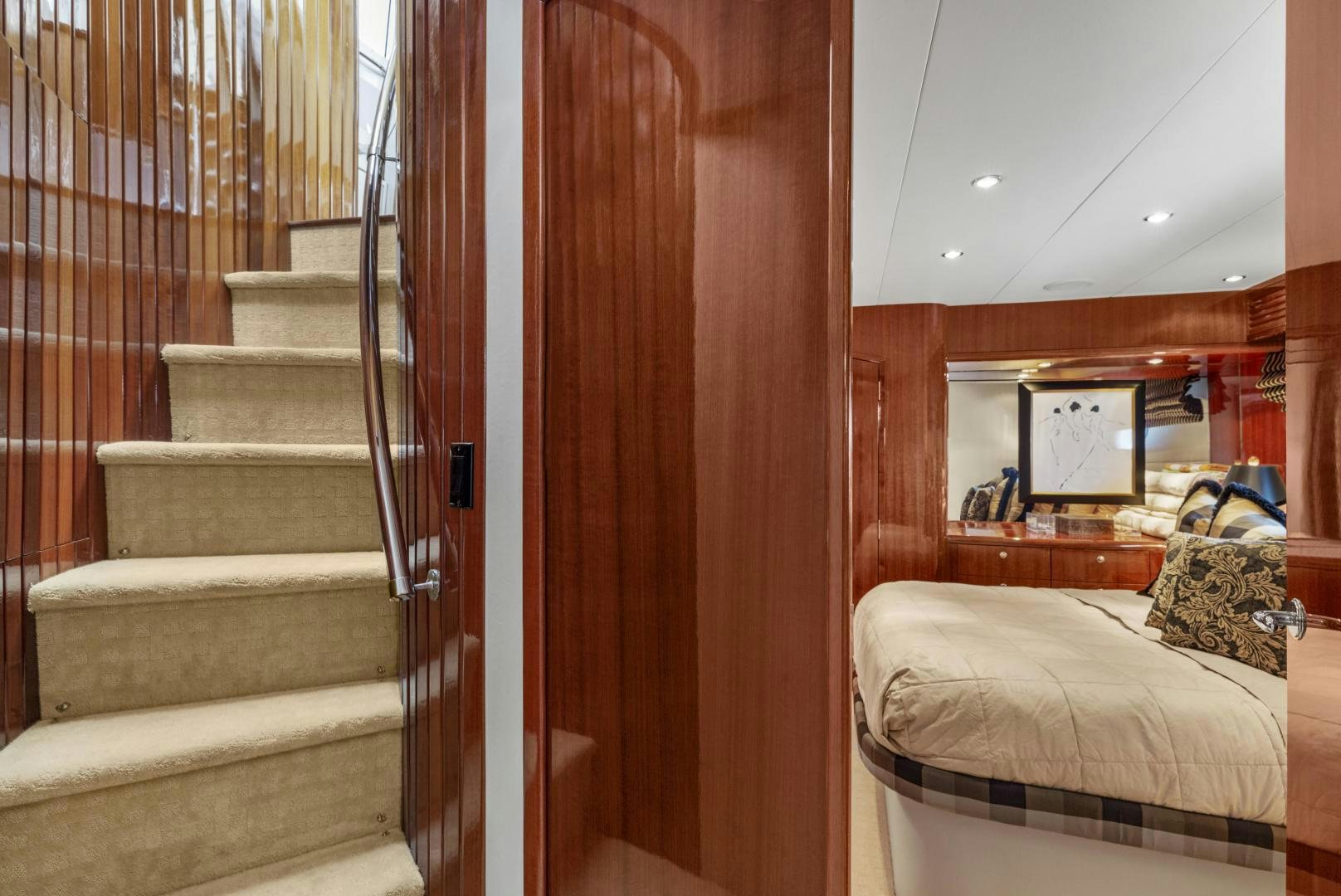 a room with a bed and a staircase aboard RILASSARI Yacht for Sale