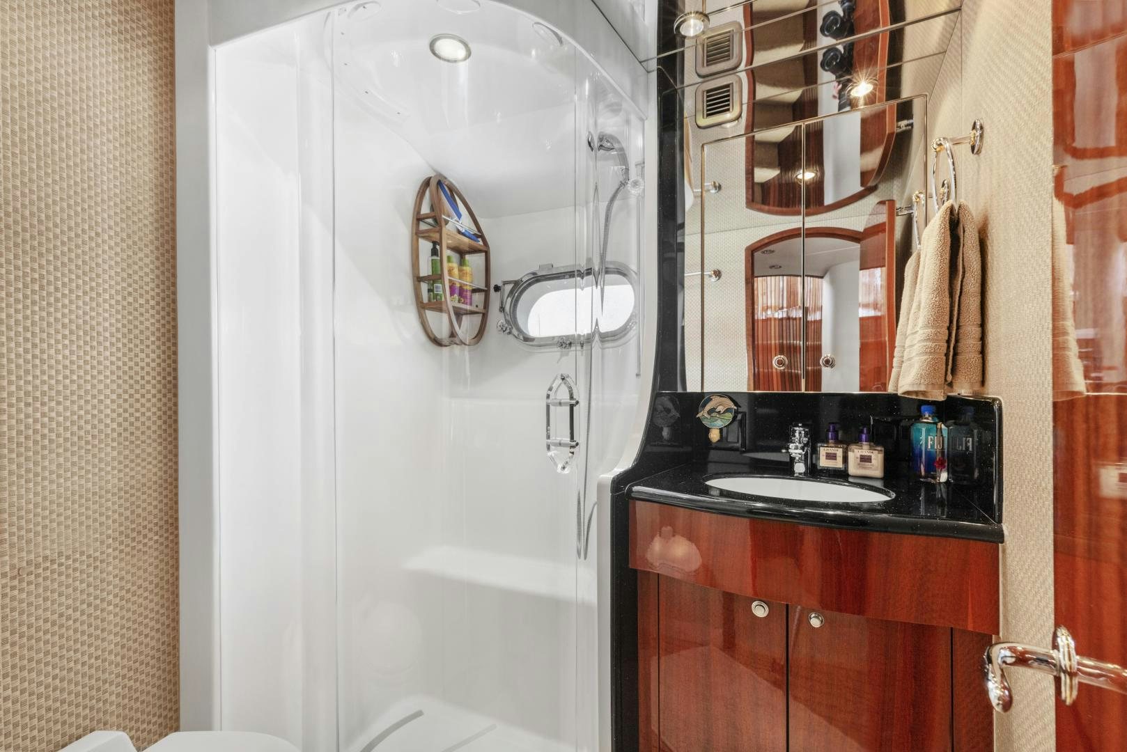 a bathroom with a large mirror aboard RILASSARI Yacht for Sale