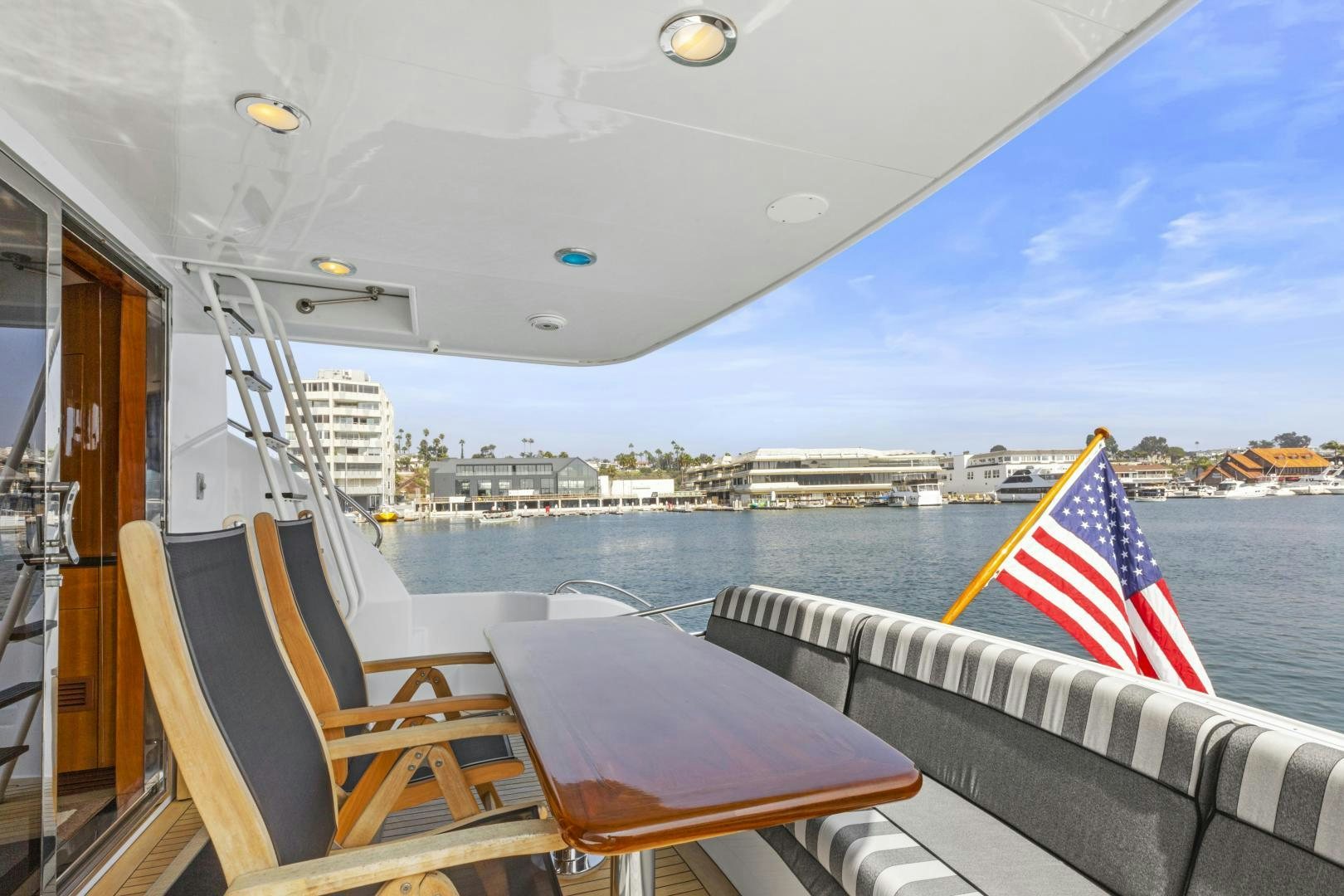 a boat with a flag on the front aboard RILASSARI Yacht for Sale