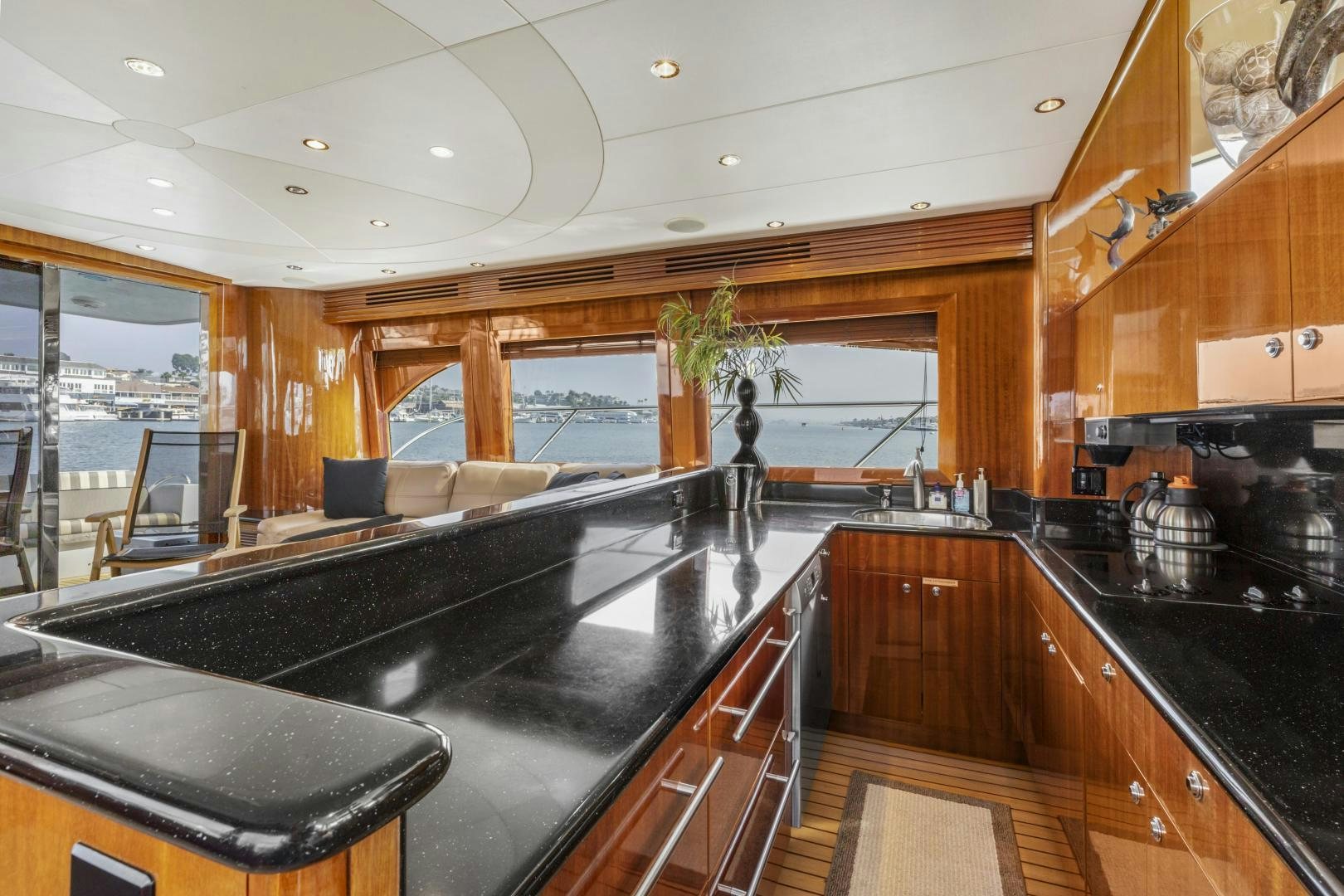 a kitchen with black counter tops aboard RILASSARI Yacht for Sale