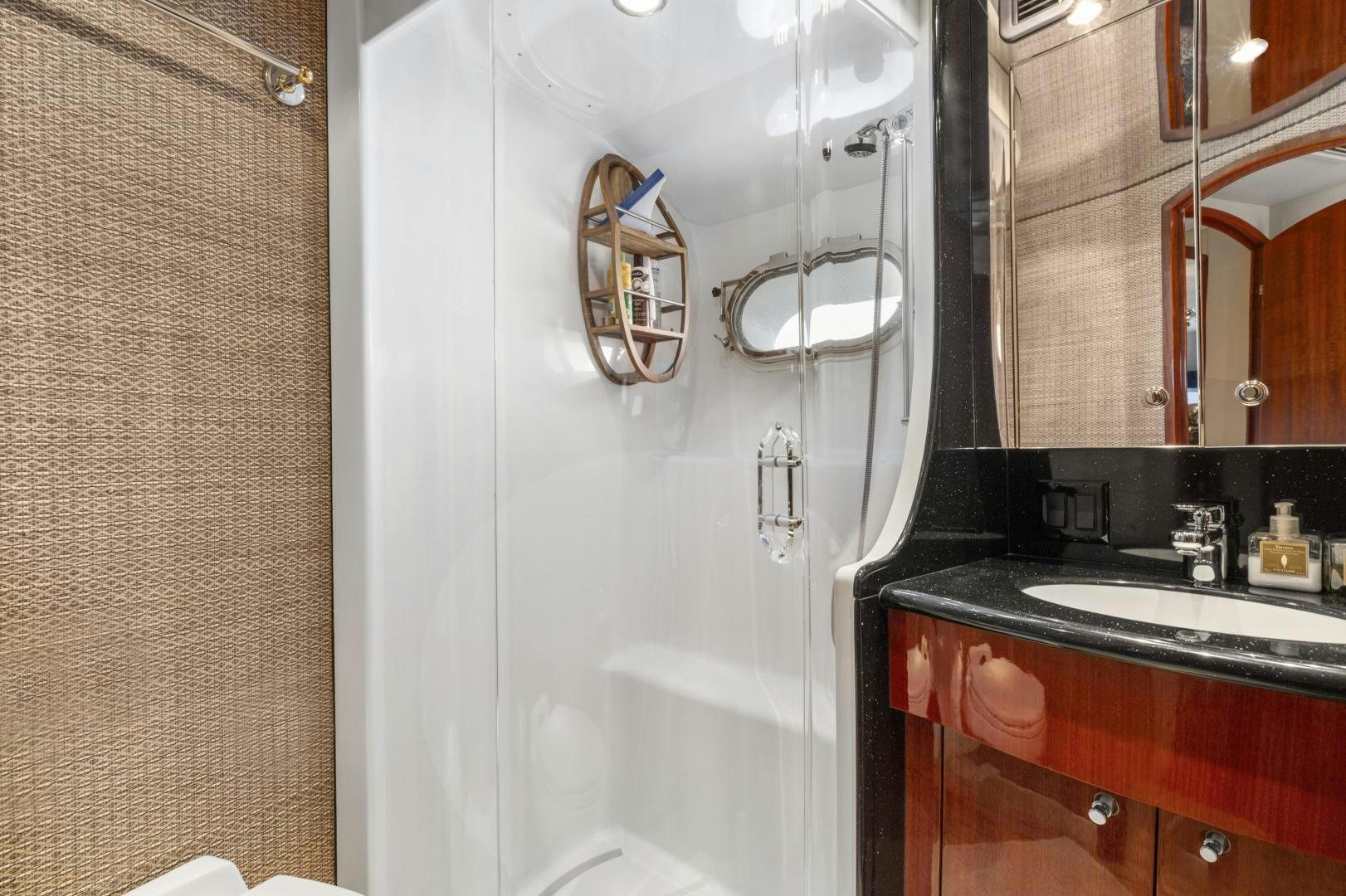 a bathroom with a shower and sink aboard RILASSARI Yacht for Sale