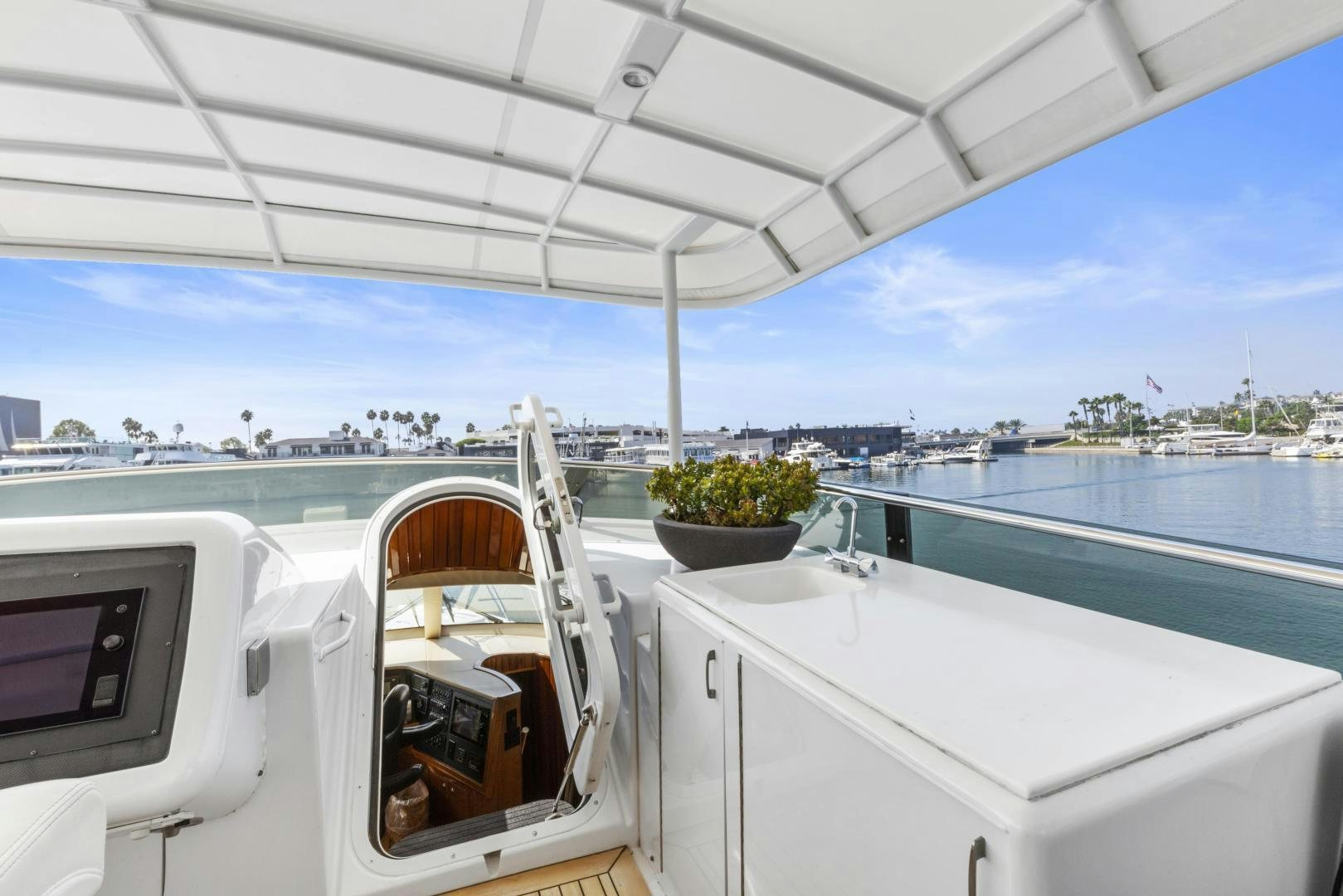 a boat with a potted plant on the deck aboard RILASSARI Yacht for Sale