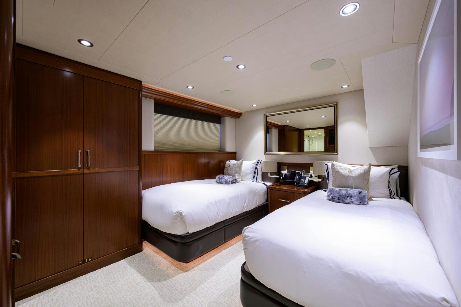 a room with a bed and a cupboard aboard LADY JJ Yacht for Sale