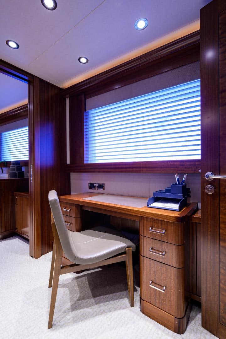 a chair in a room aboard LADY JJ Yacht for Sale